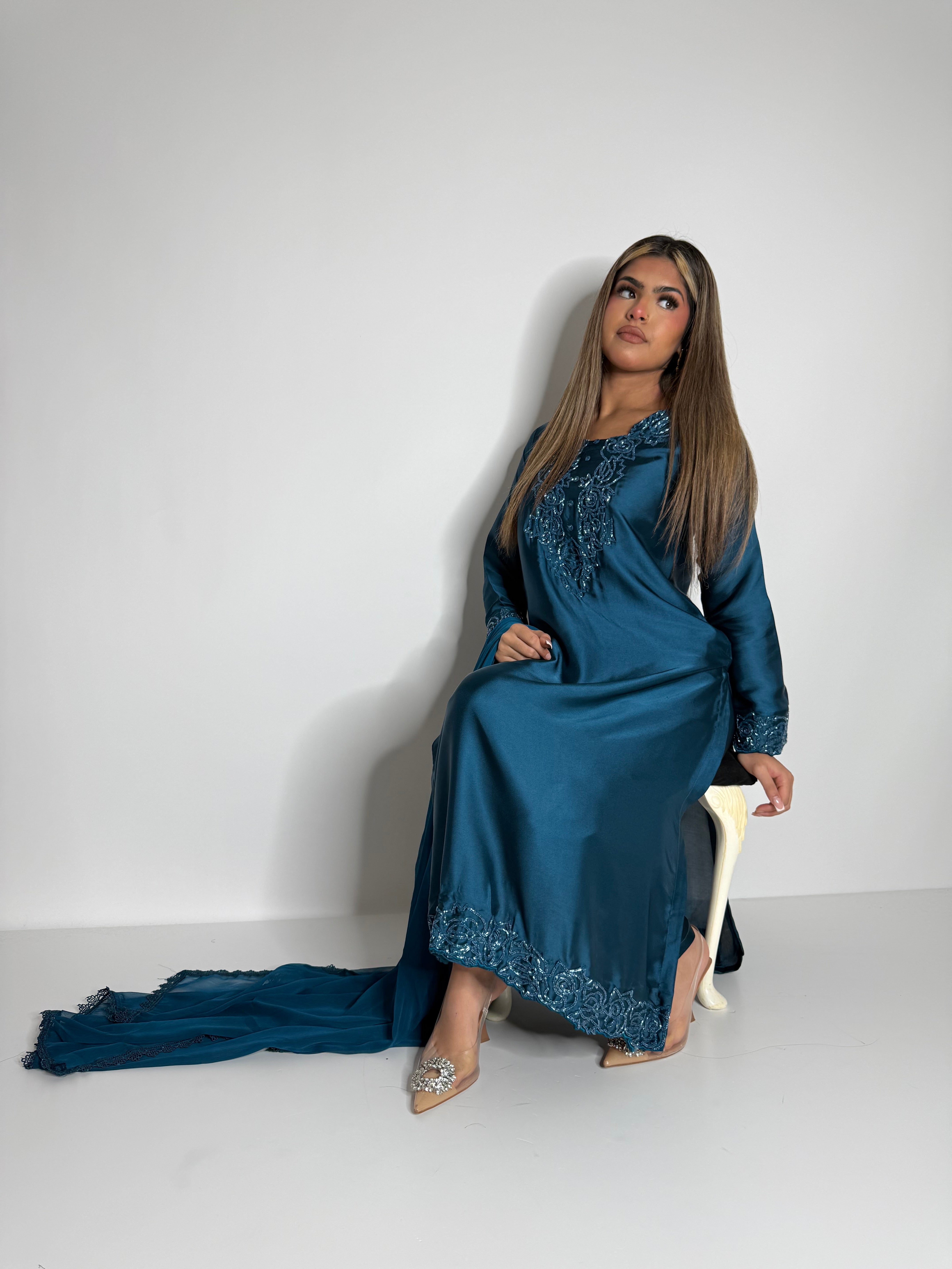 Chiffon dupatta detail paired with teal blue silk embroidered outfit