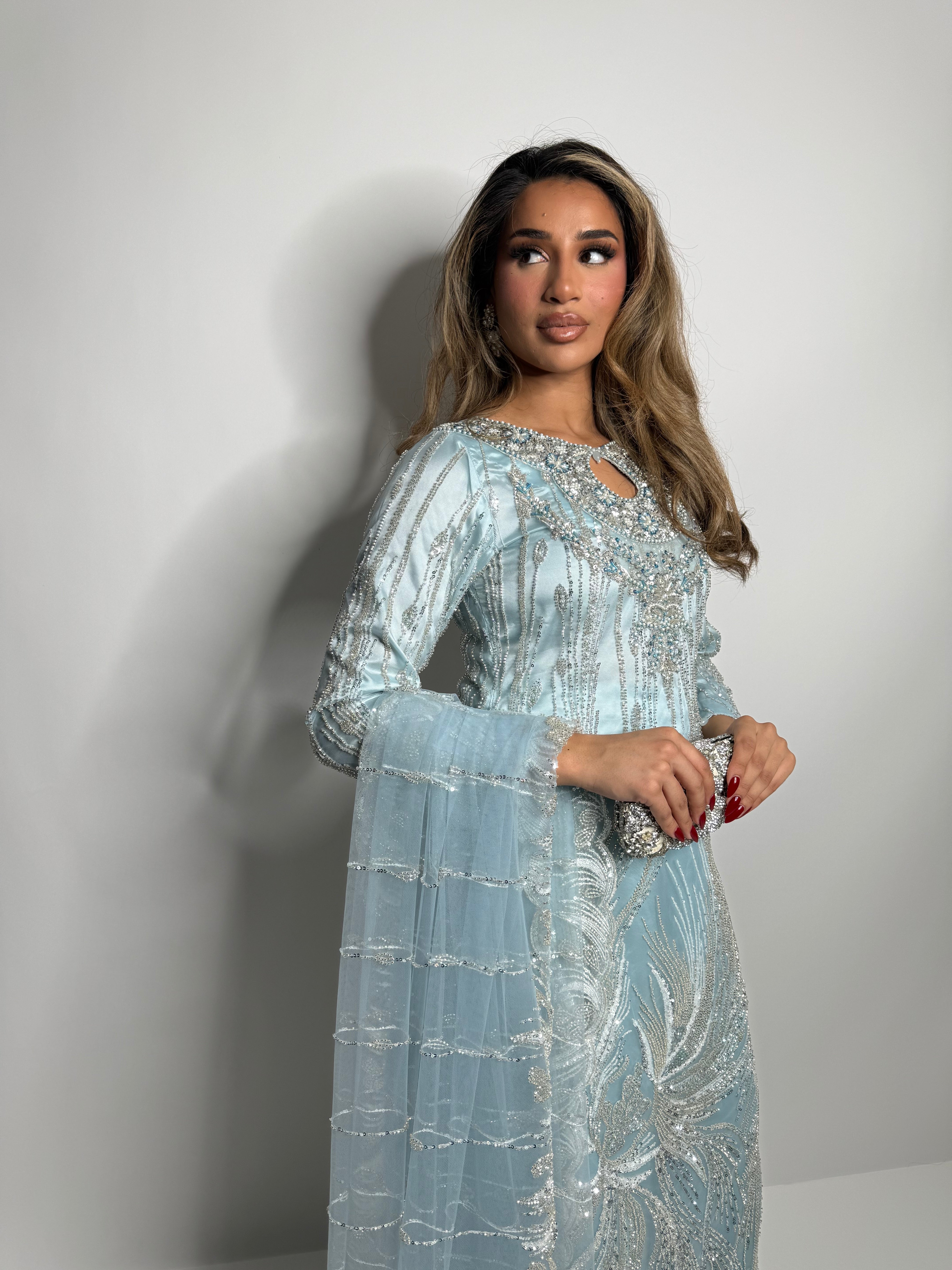 Luxury desi formalwear — Cyrine ice blue cutdana suit styled with silver clutch