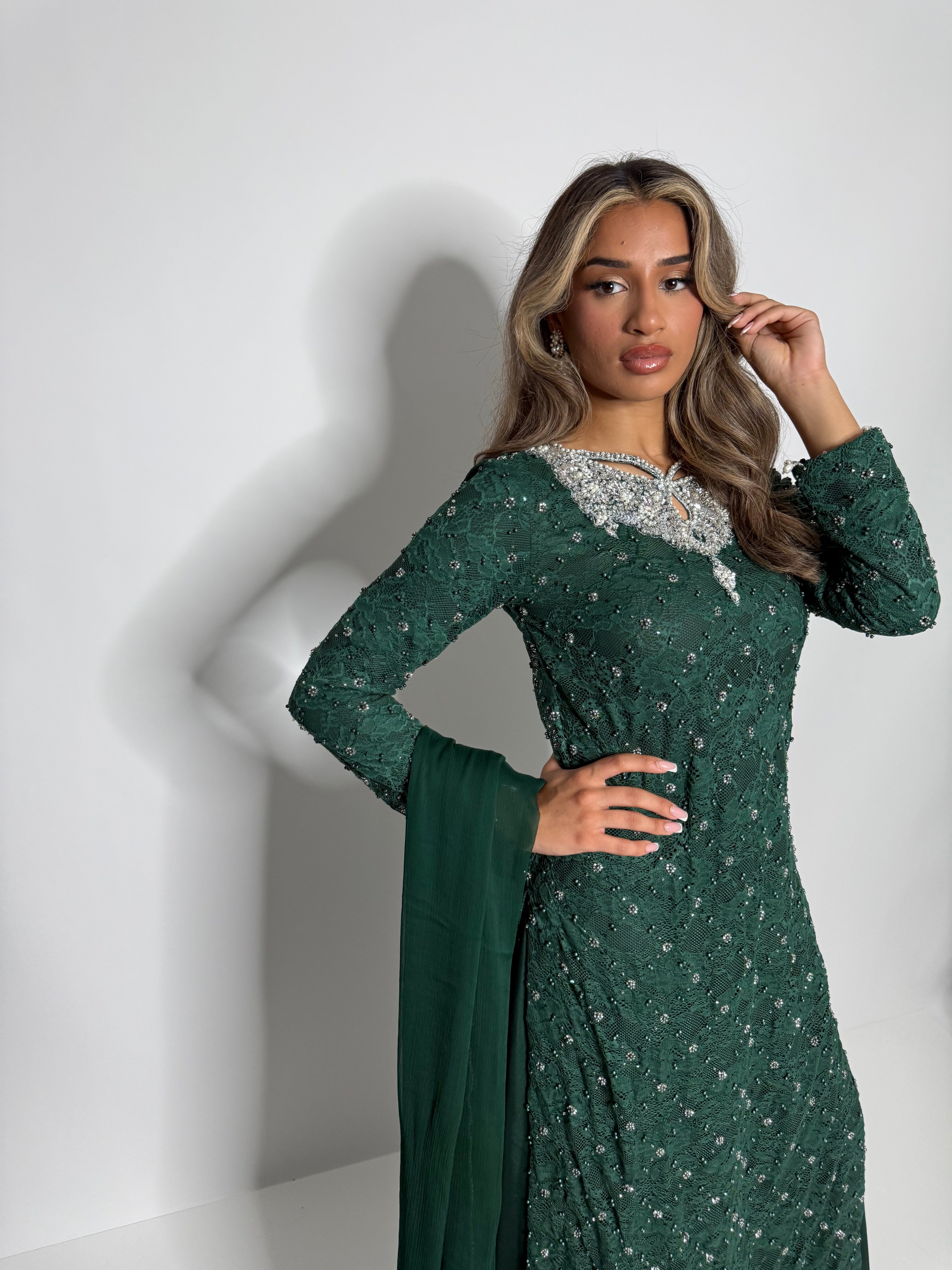 Formal Pakistani wedding guest outfit in emerald green with pearl detailing and couture dupatta by Ameliyana Boutique