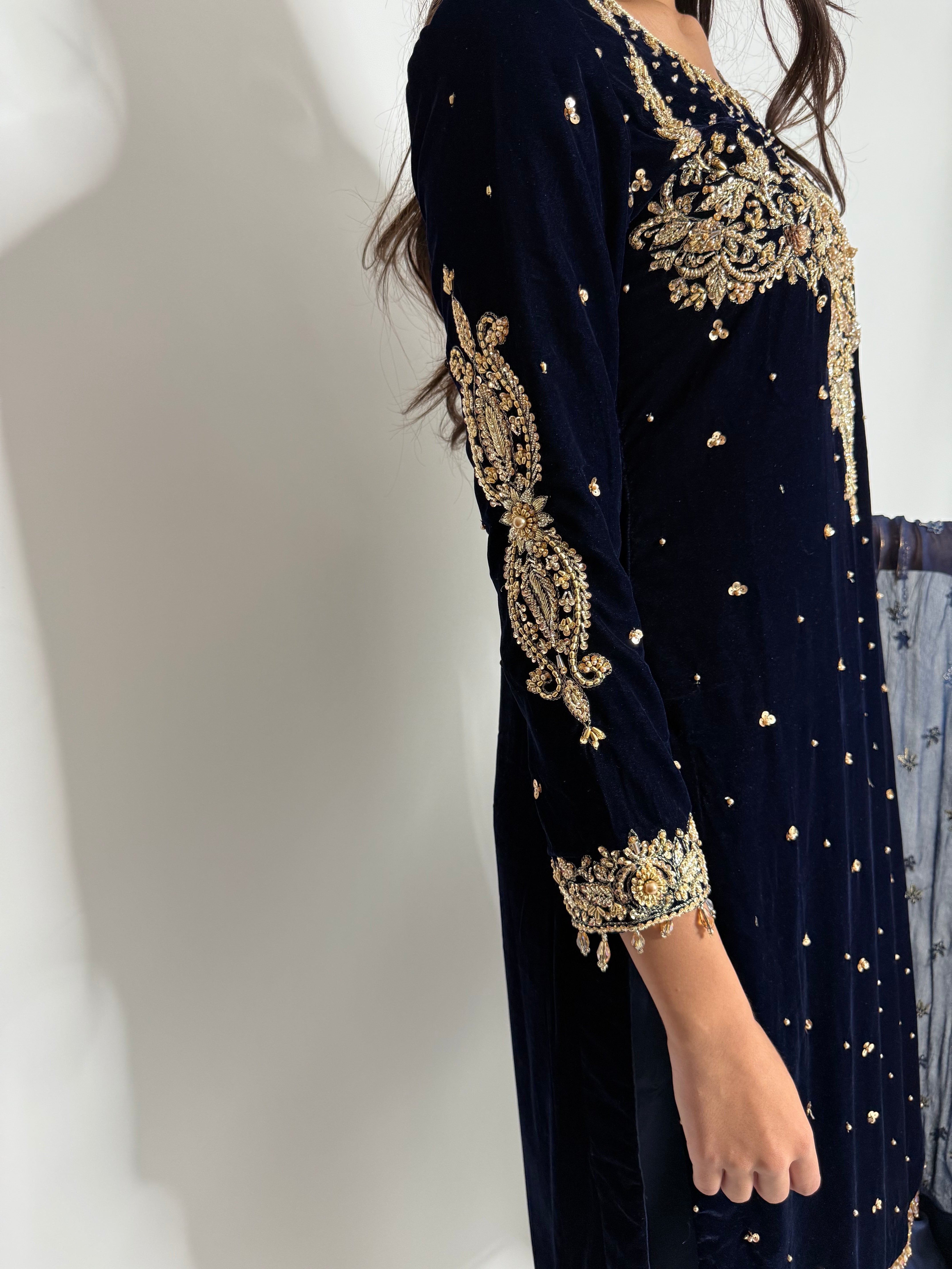 Full-length shot of Nerina Navy Velvet Wedding Suit styled for winter occasions.