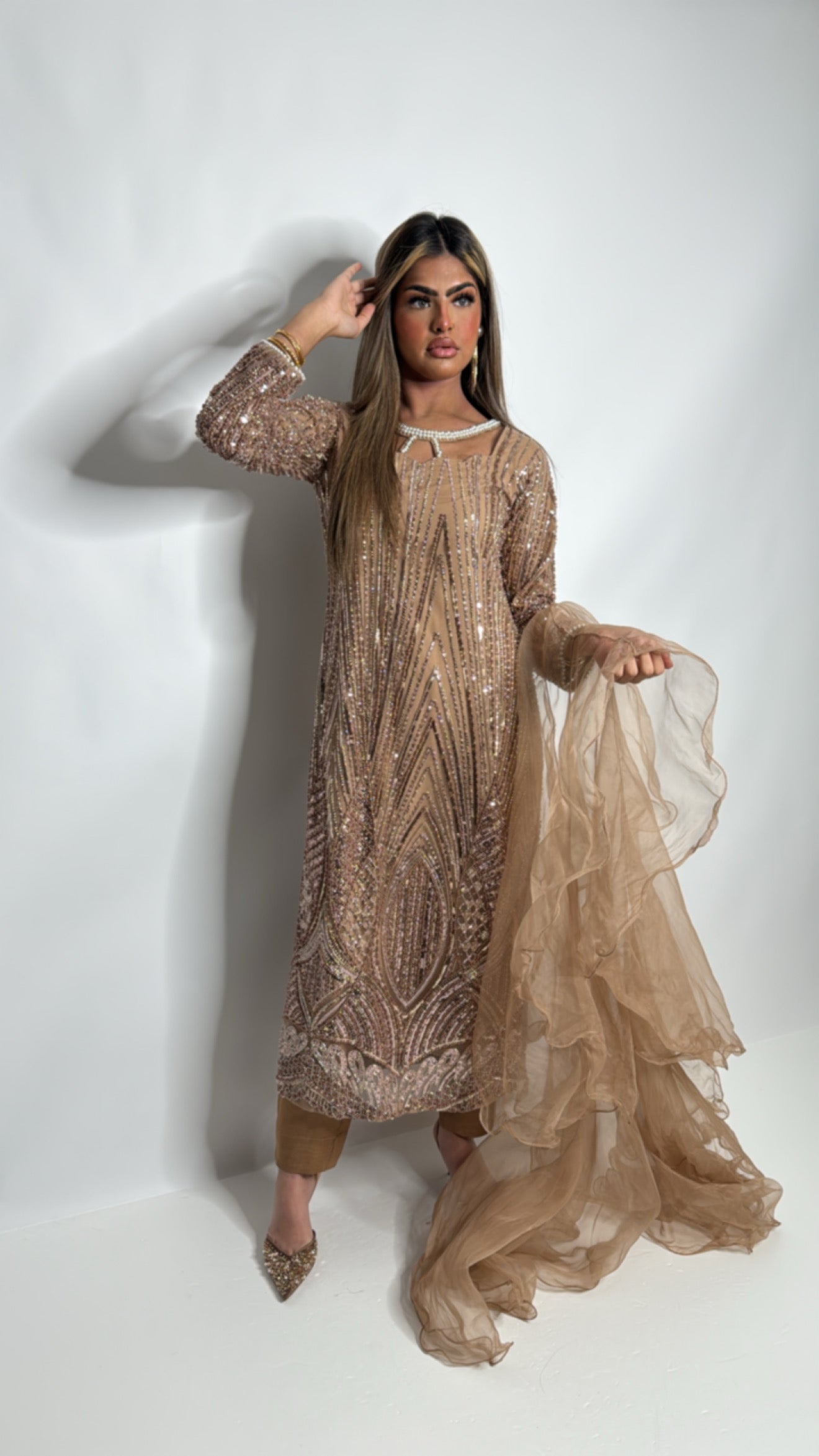 Pakistani festive outfit with soft frilly dupatta and refined handwork detailing