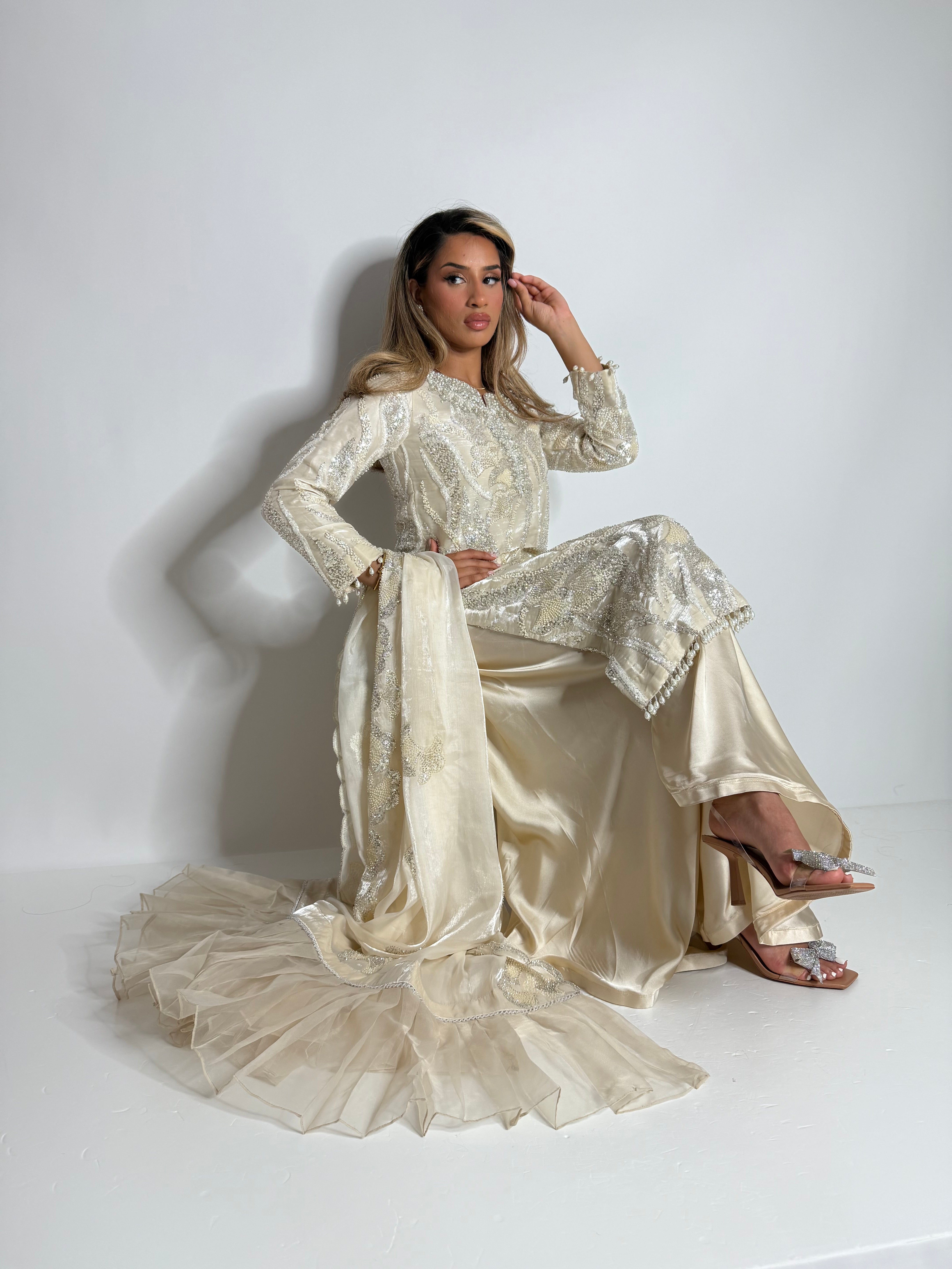 Pakistani wedding guest ivory three-piece with cutdana embellishment and organza frill dupatta