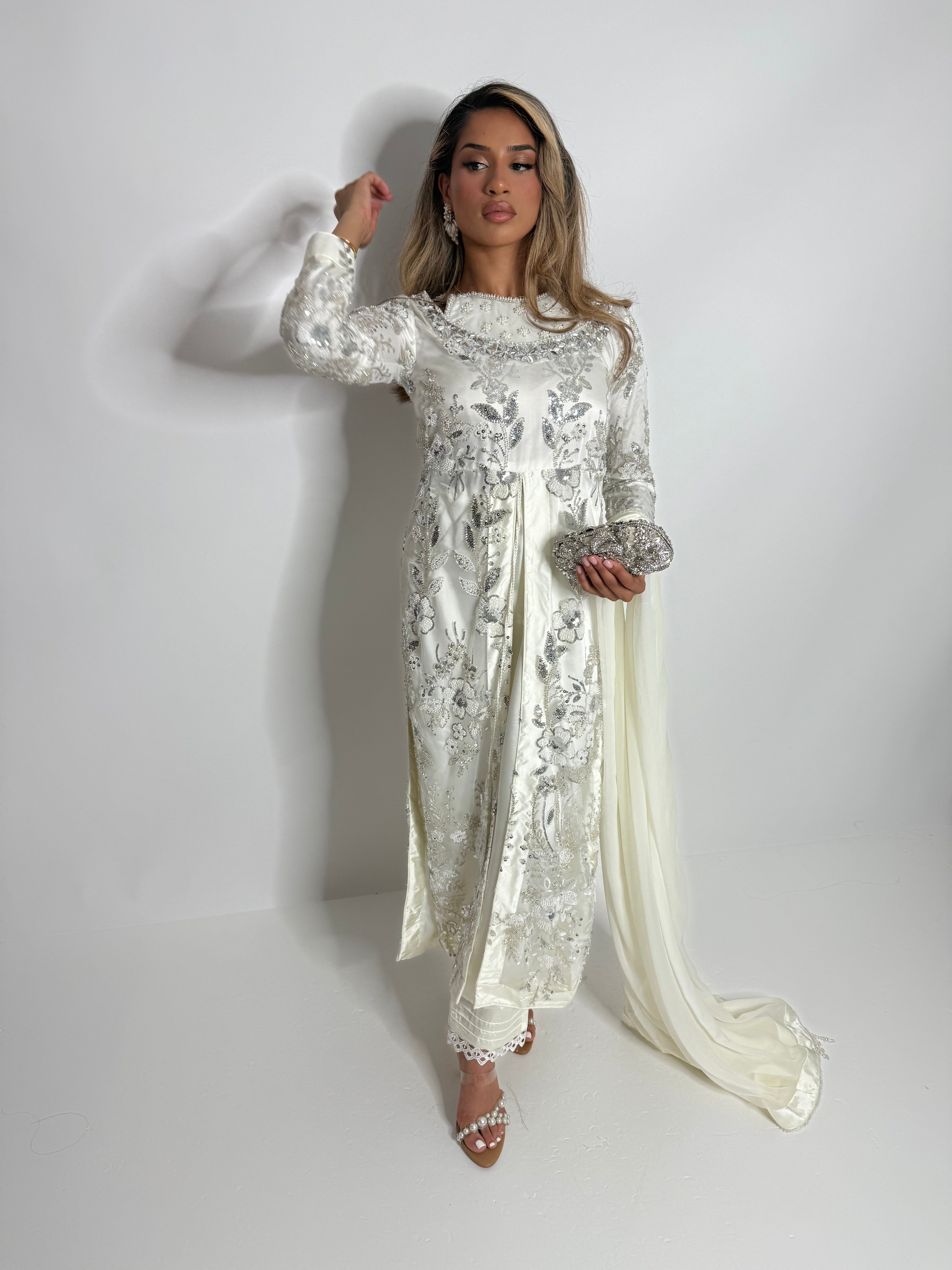 Full-length front view of Zerina outfit styled with lace hem trousers.