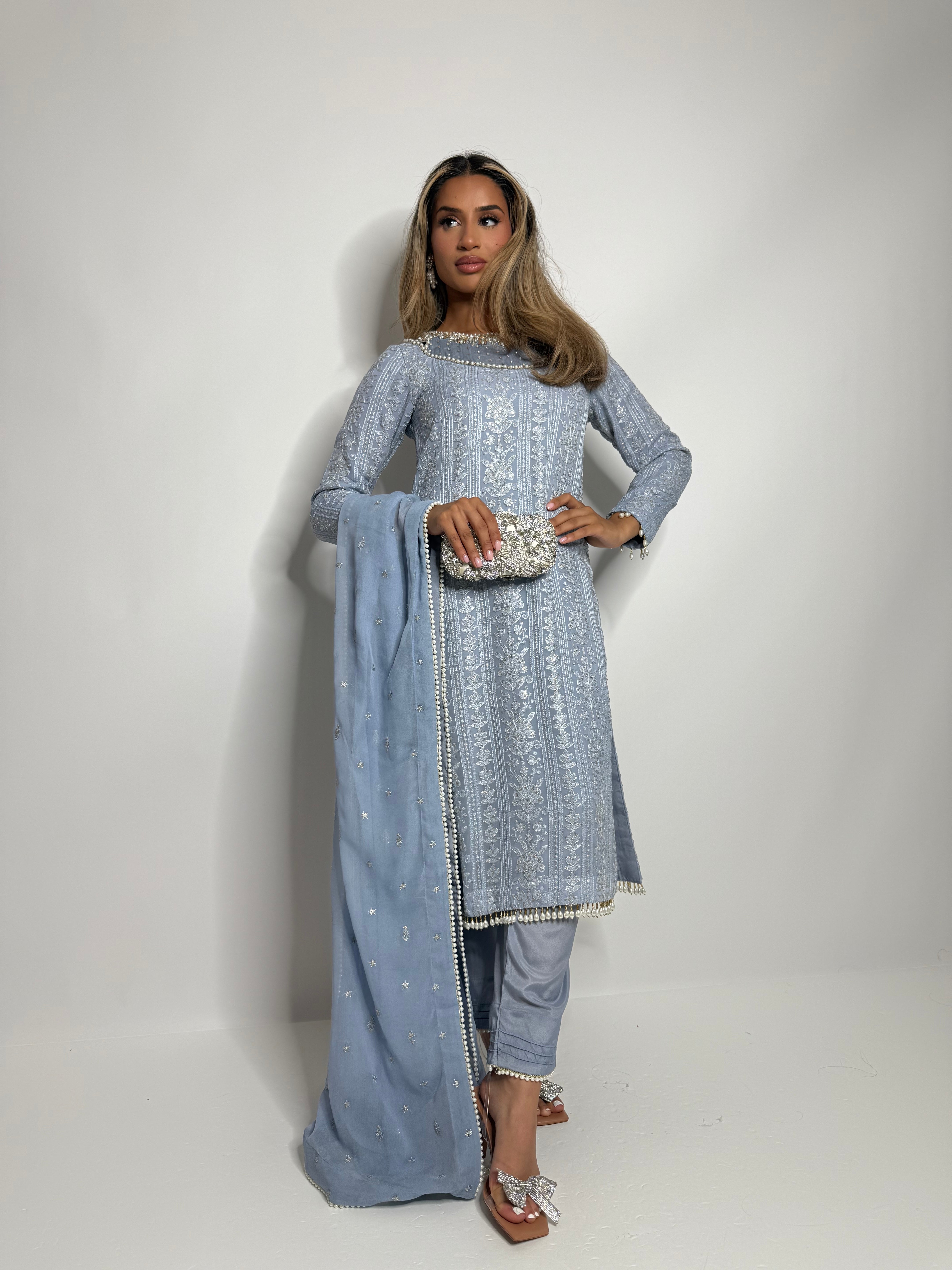 Blue chicken-kari Pakistani outfit with pearl finishing
