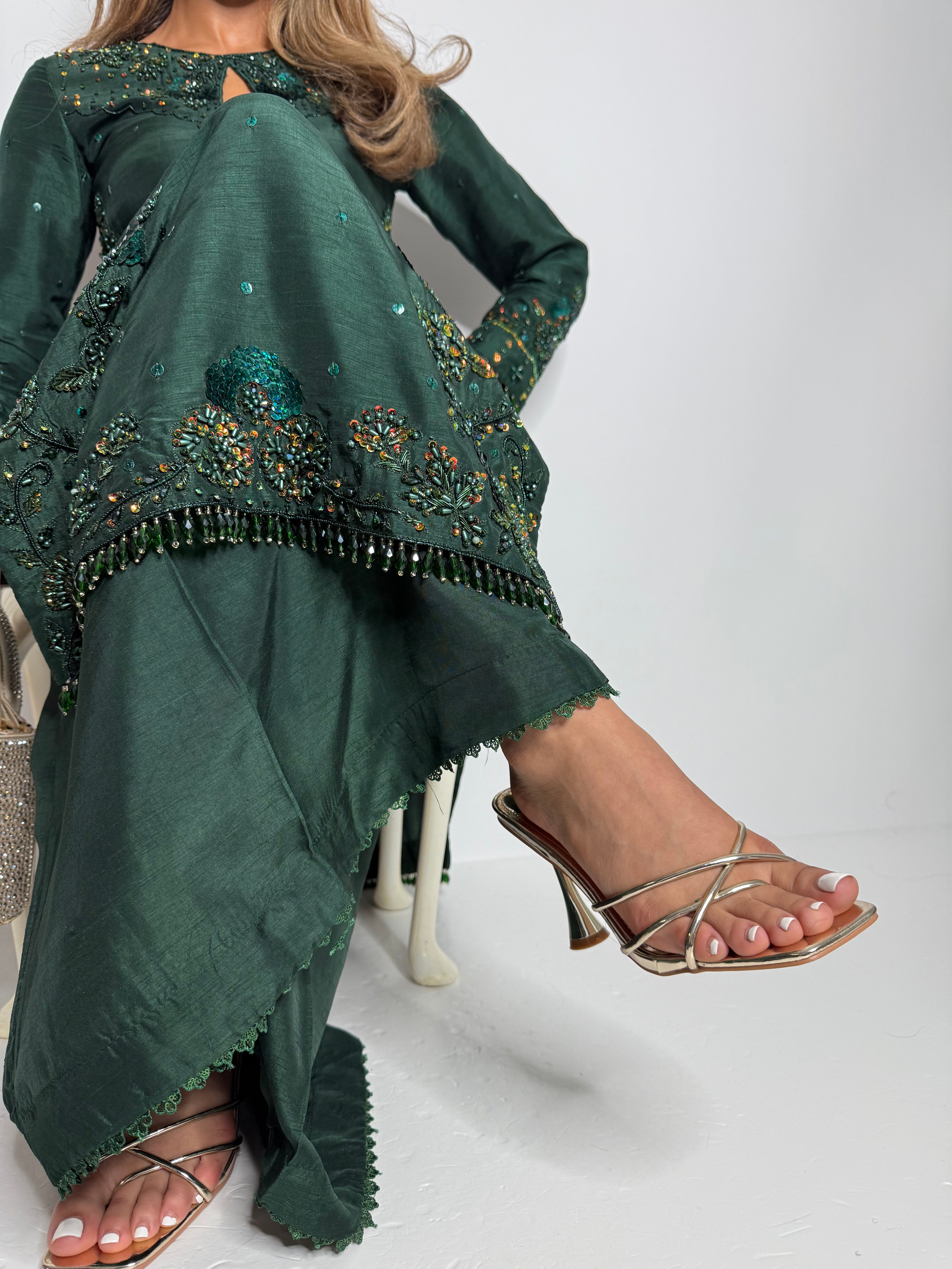 Hand-embroidered emerald green Pakistani suit for Eid