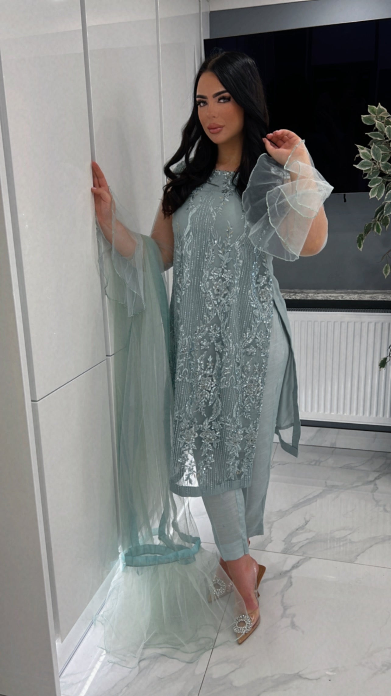 Model wearing Elsa blue Pakistani outfit with organza dupatta