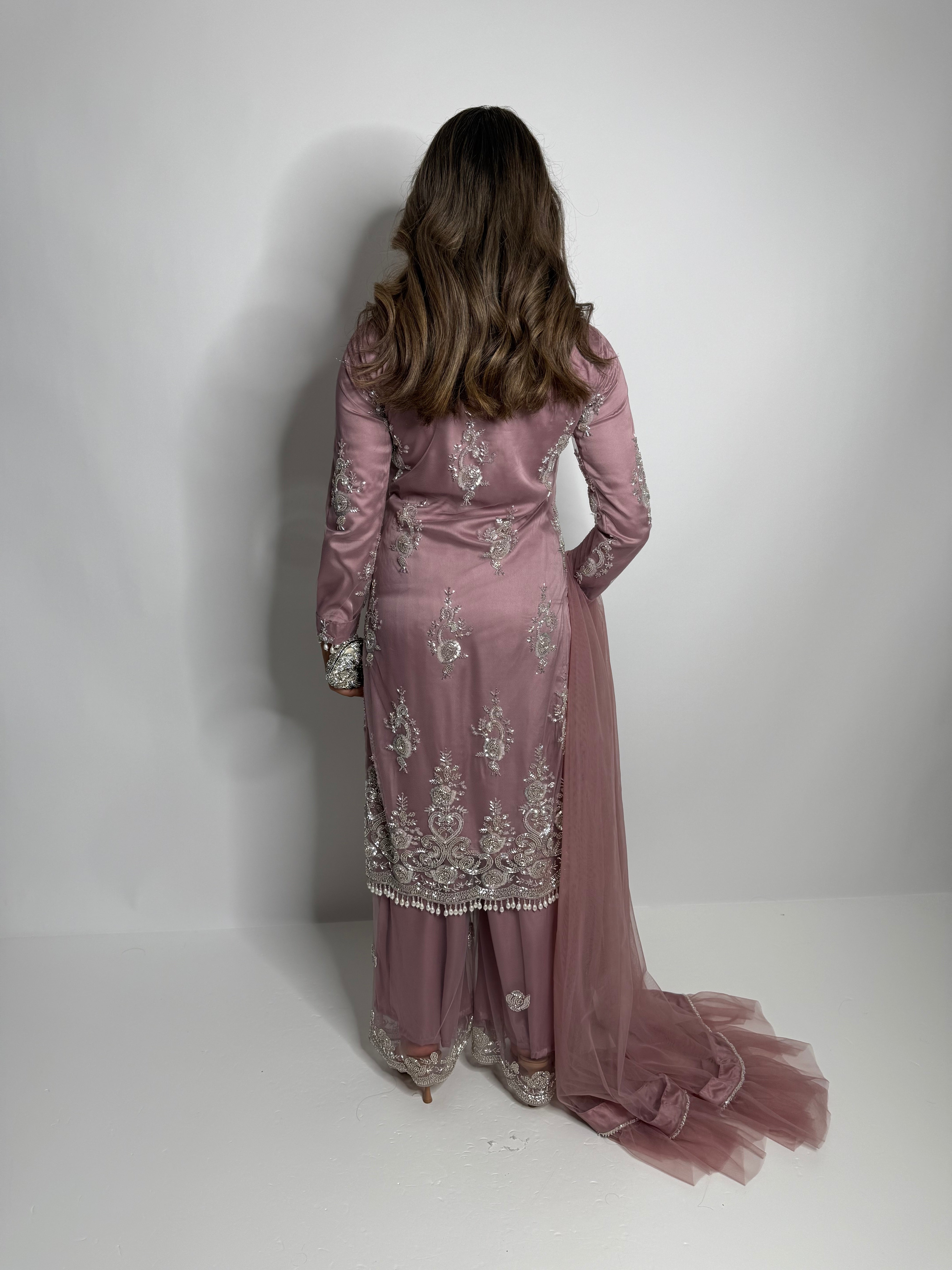 Pakistani suit with flared trousers and embroidery.
