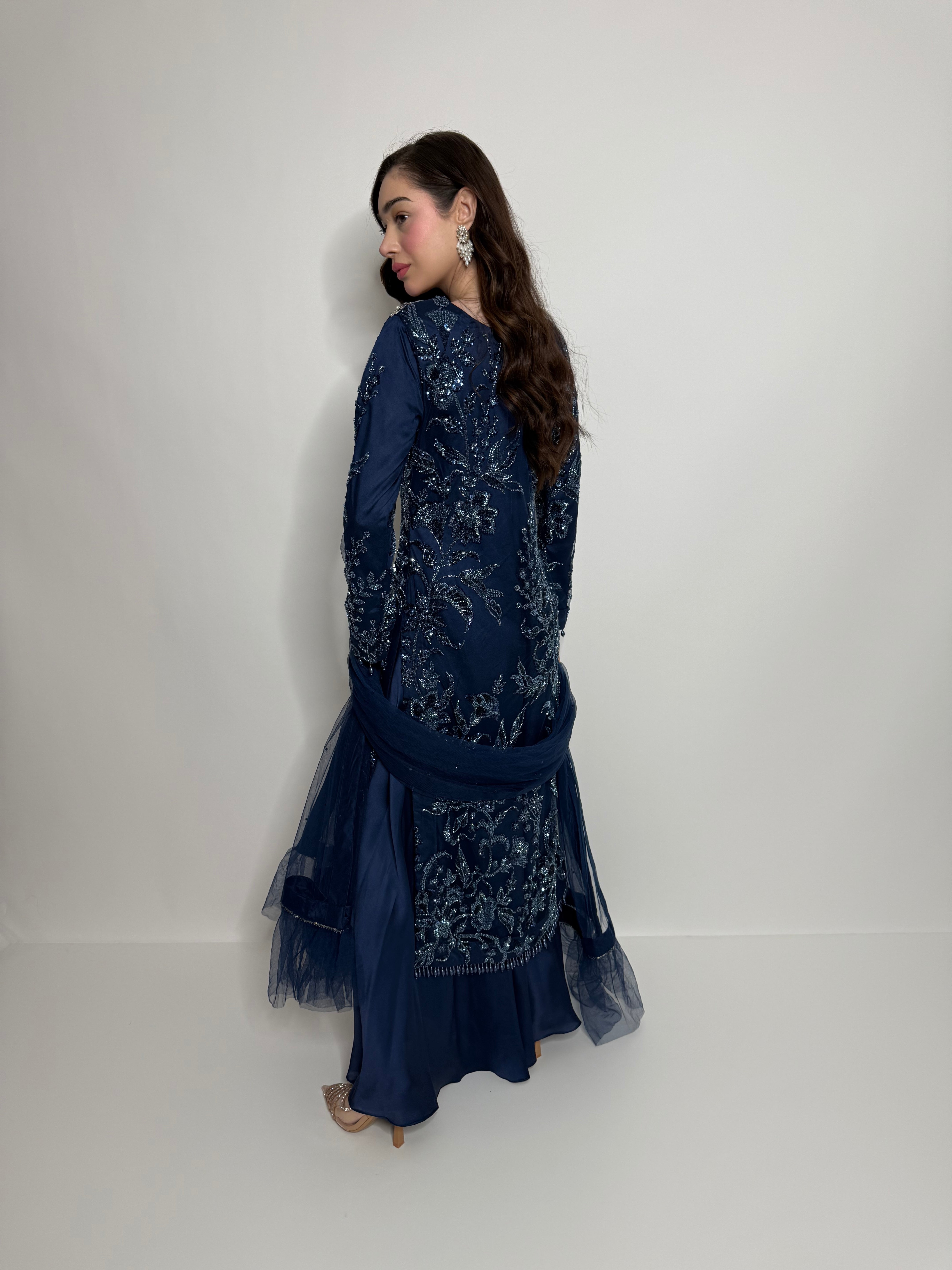 Back view of navy silk embroidered shirt with intricate cutdana work