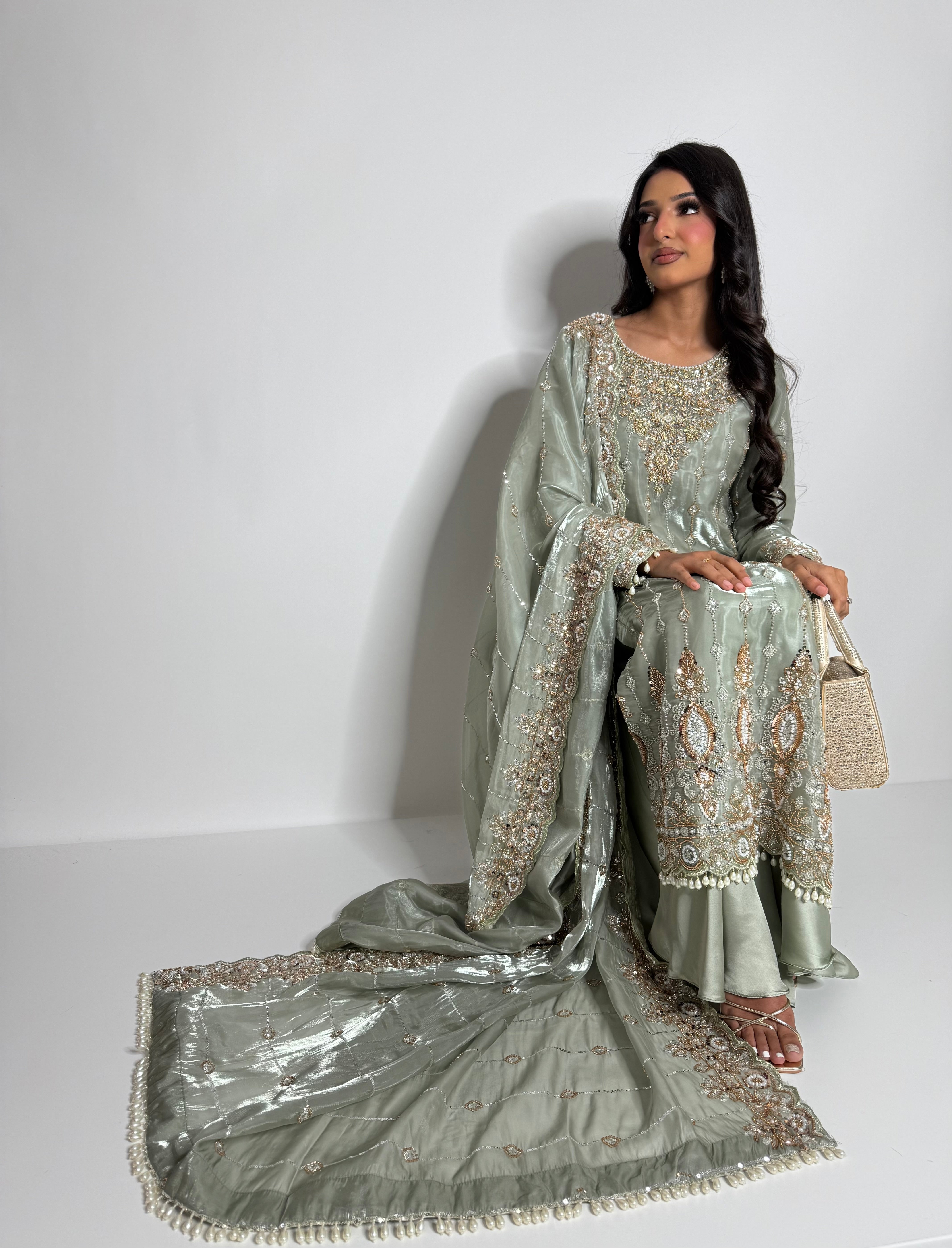 Hand-embroidered cutdana outfit with statement neckline