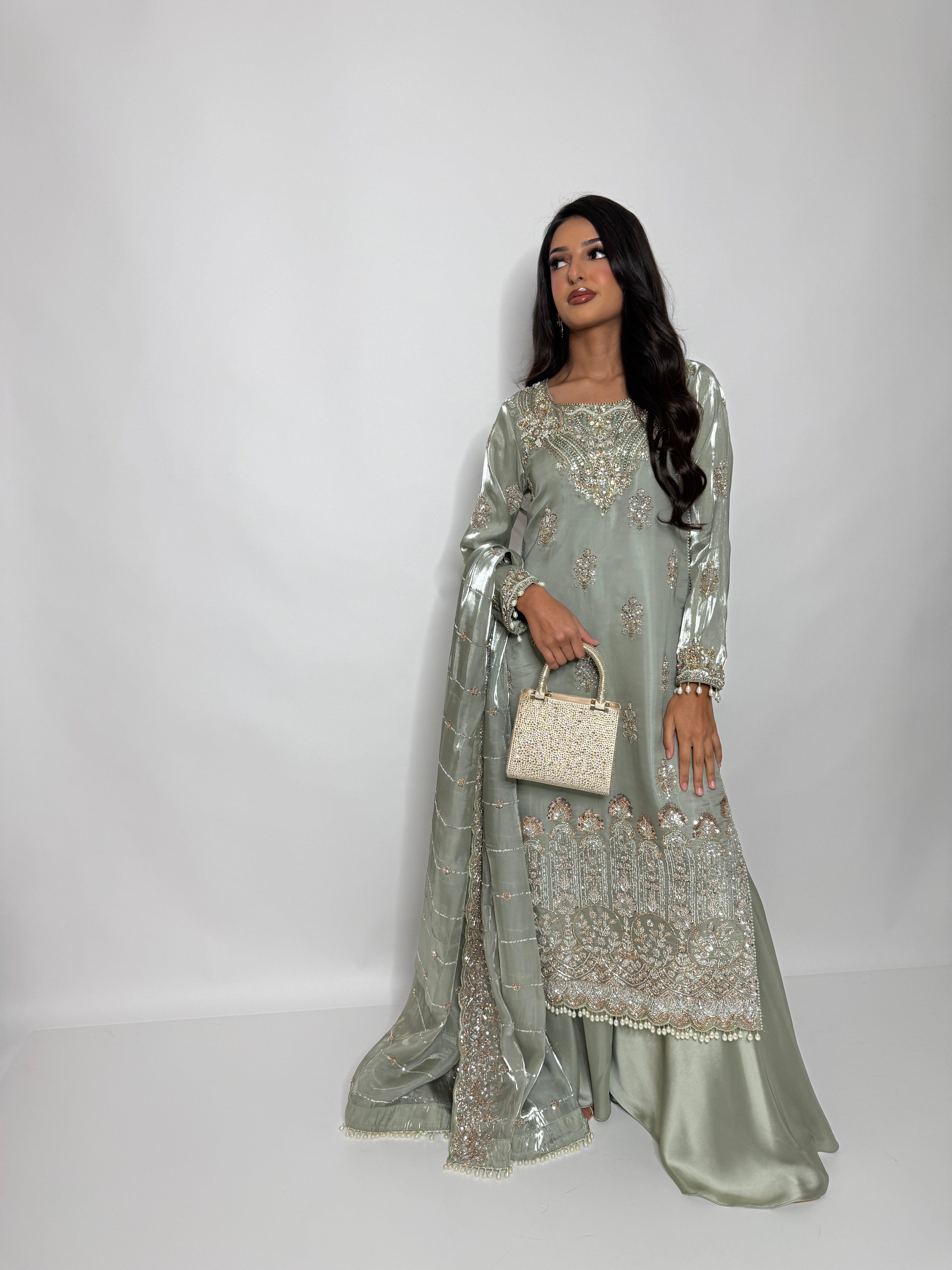Sage green wedding guest outfit with pearl embellished dupatta