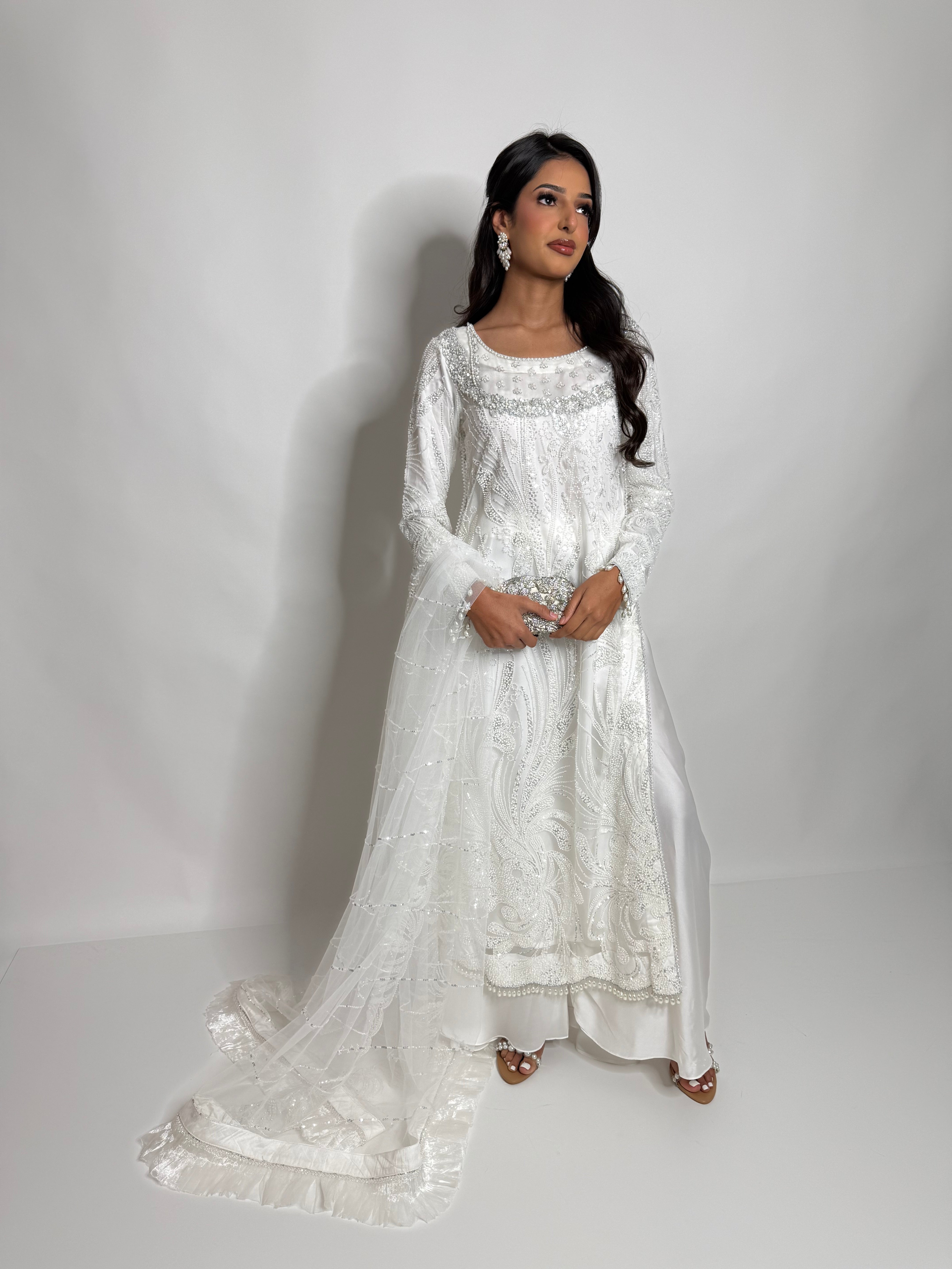 White nikah sharara suit with detailed cutdana and hand embroidery