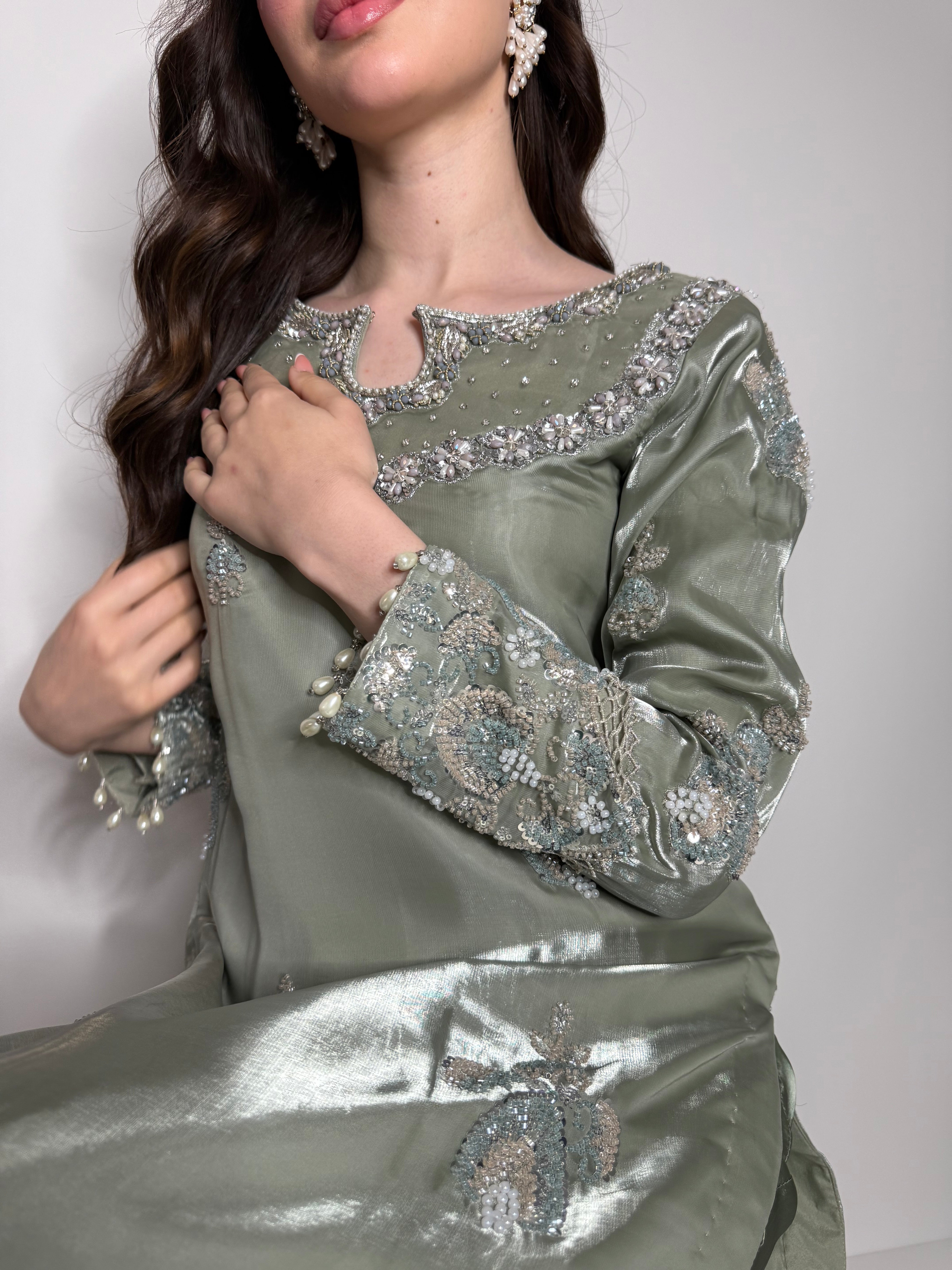 close up of cutdana embroidery and pearl detailing on sage silk Eid outfit