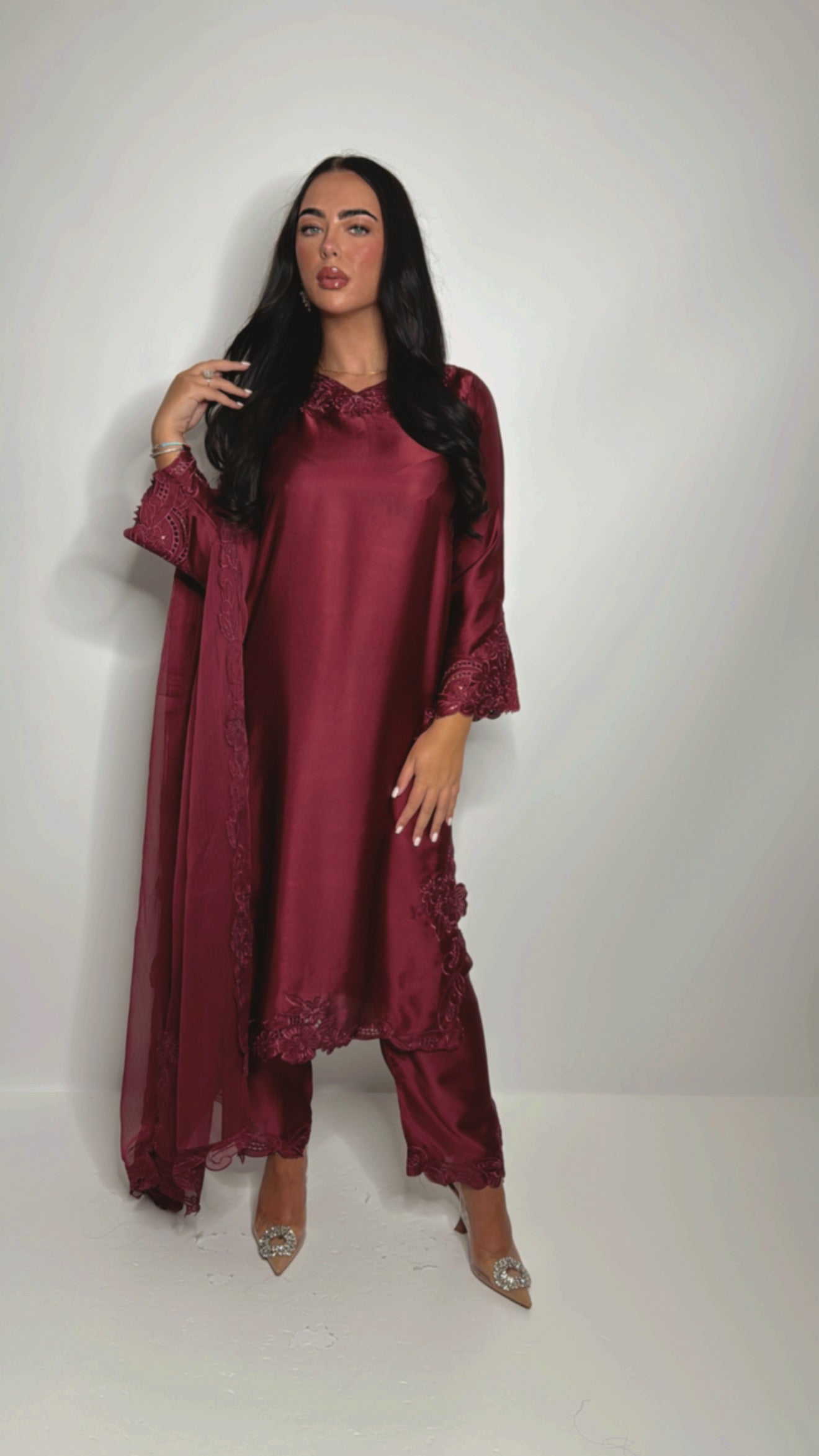 Model wearing wine satin Pakistani suit with embroidered dupatta — formal party outfit