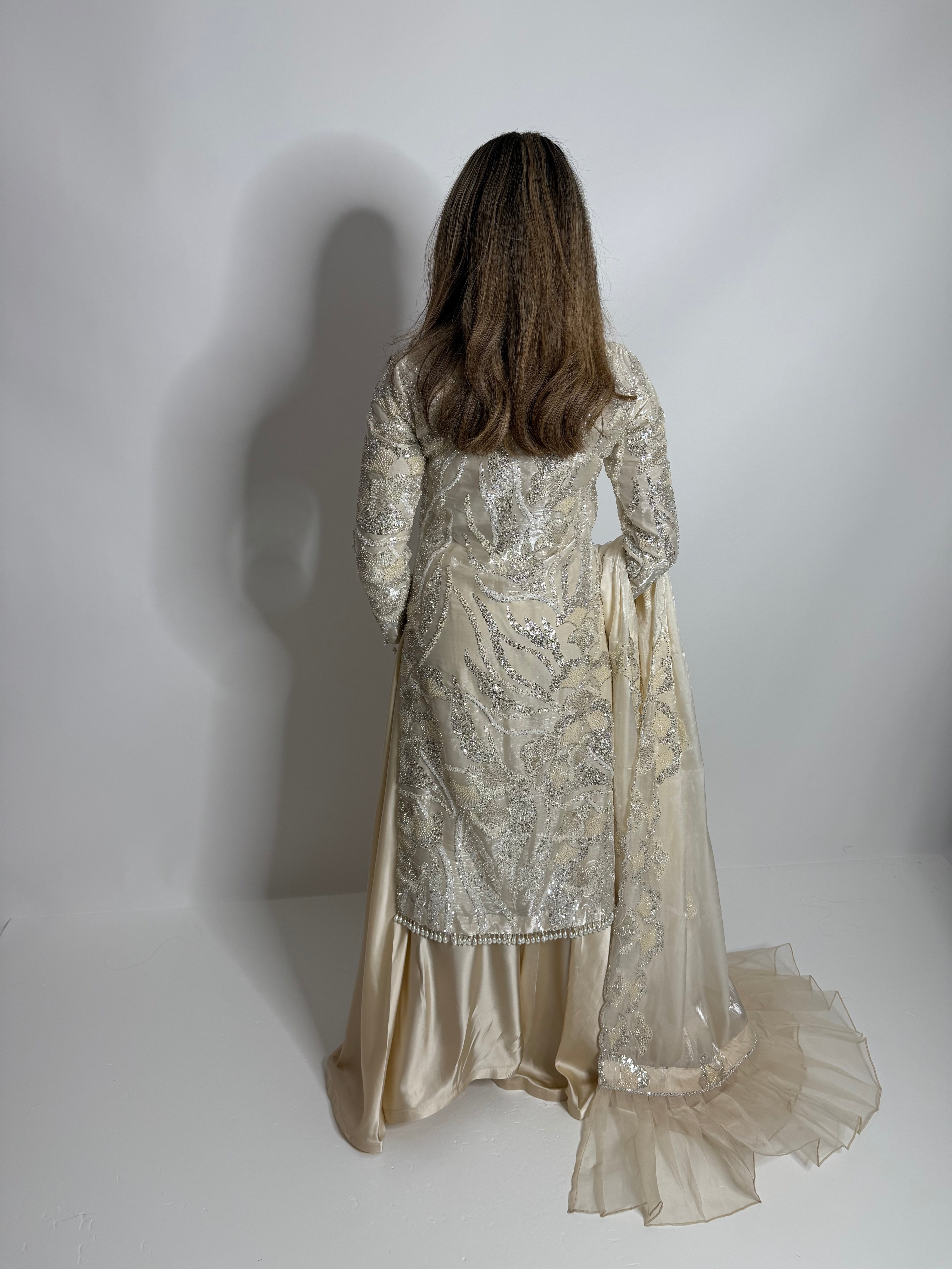 Ivory Pakistani outfit with cutdana embroidery, pearl details, silk side-flare trousers, and luxury dupatta