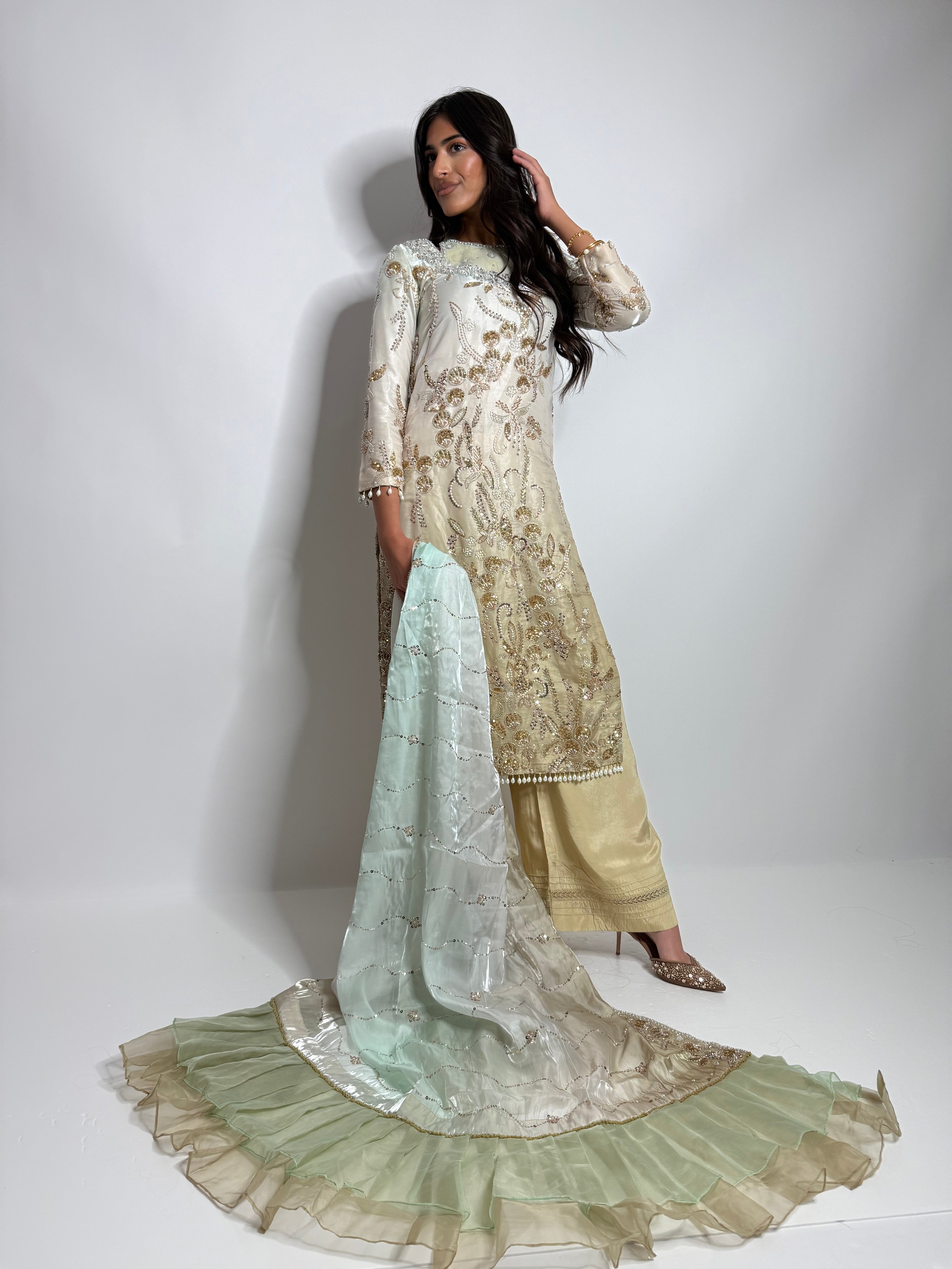 Front full view of ivory and gold silk Pakistani three-piece with embroidered dupatta.