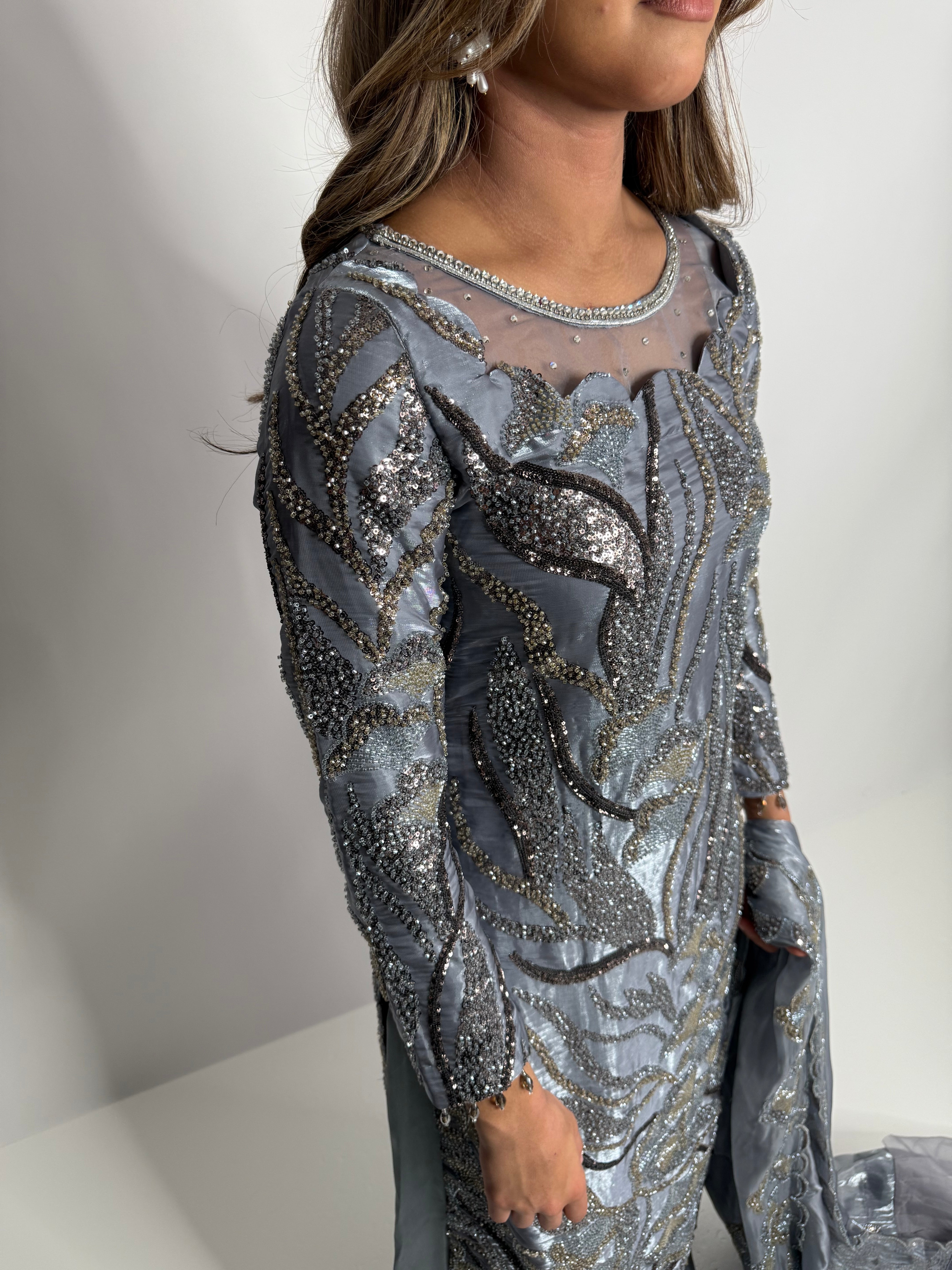 Close-up of cutdana embroidery on front and sleeves.