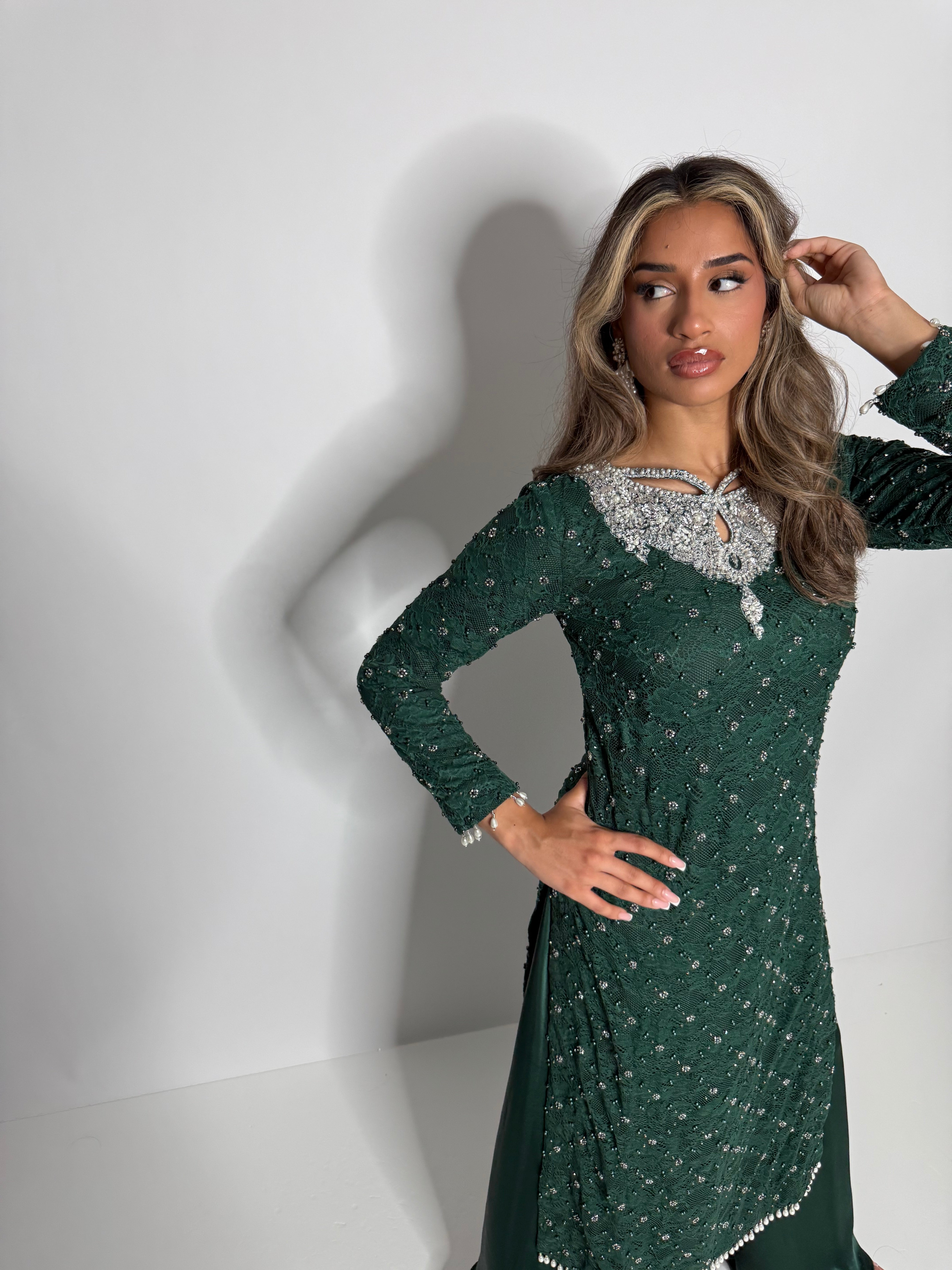 Luxury emerald crochet three-piece set with pearl embellishments, silk trousers, and designer chiffon dupatta