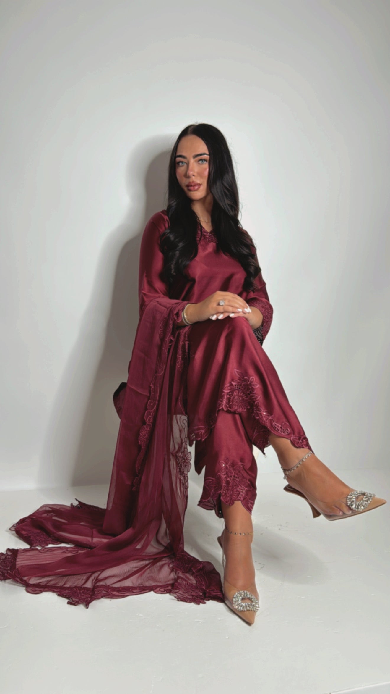 Pakistani satin suit with straight trousers and embroidered details — wedding guest look”