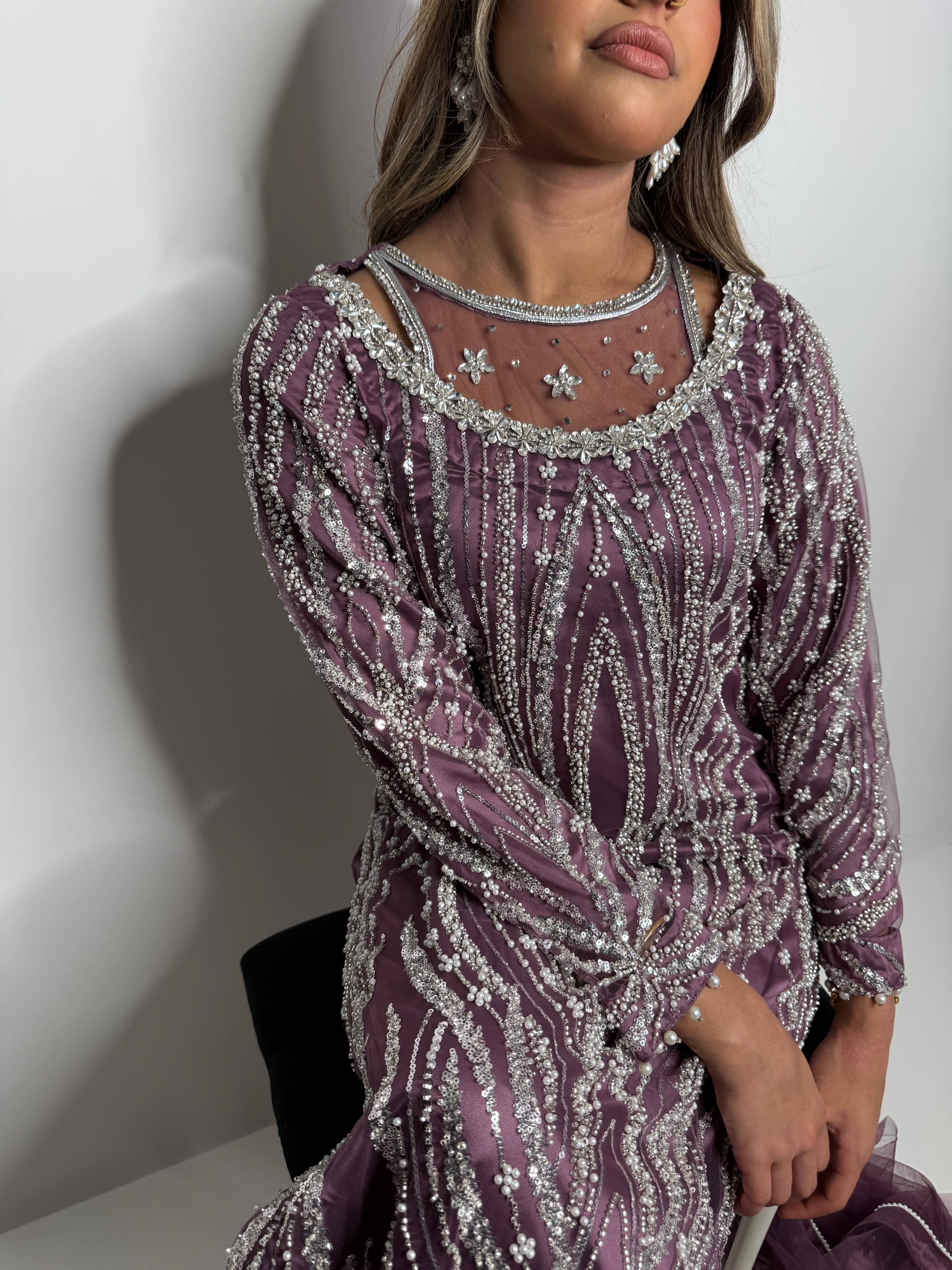 Ameliyana Boutique mauve three-piece with all-over cutdana work, pearl finishing, and frill dupatta – perfect for weddings and receptions