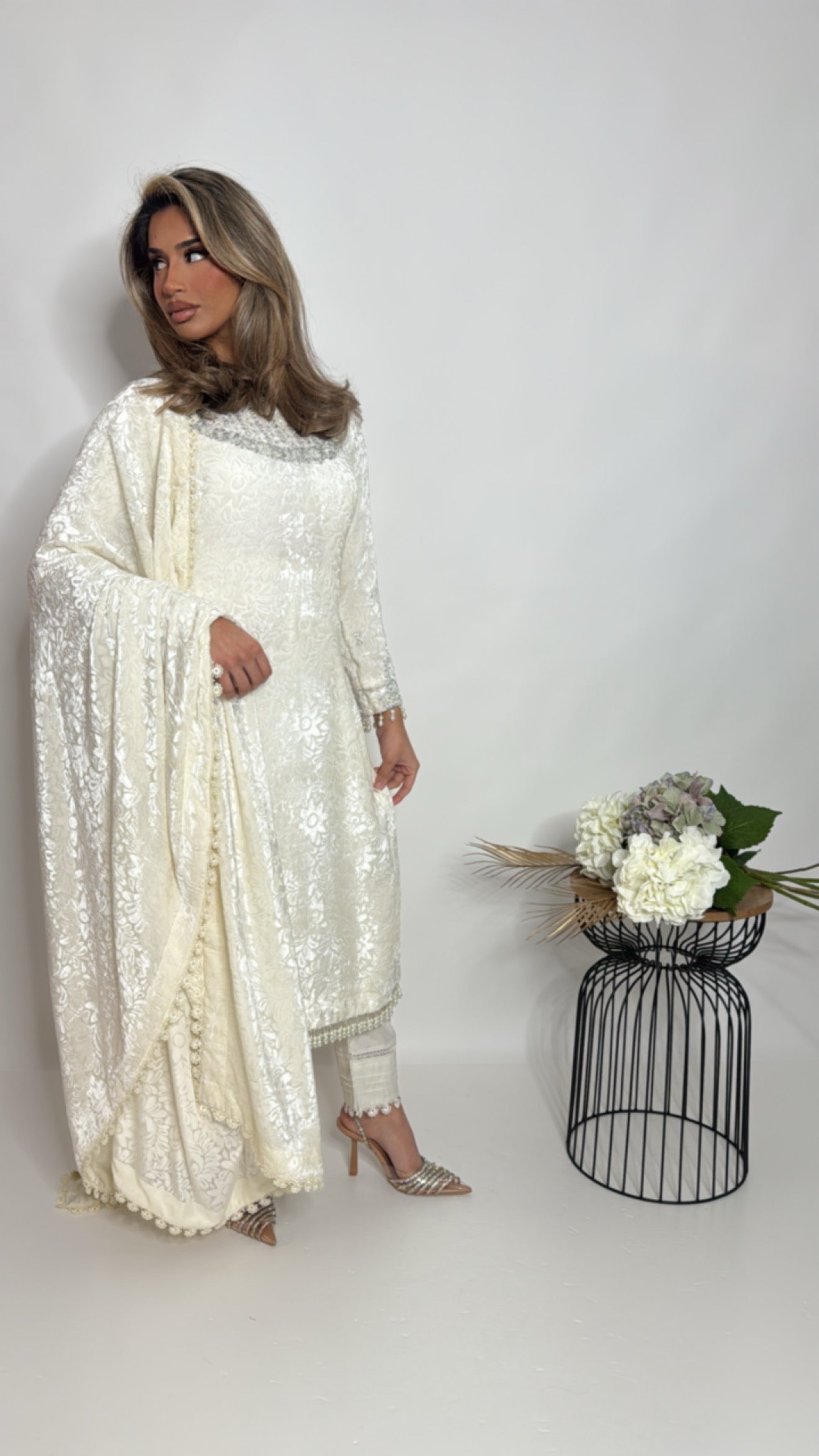 Ivory palachi dupatta with lace finishing draped elegantly