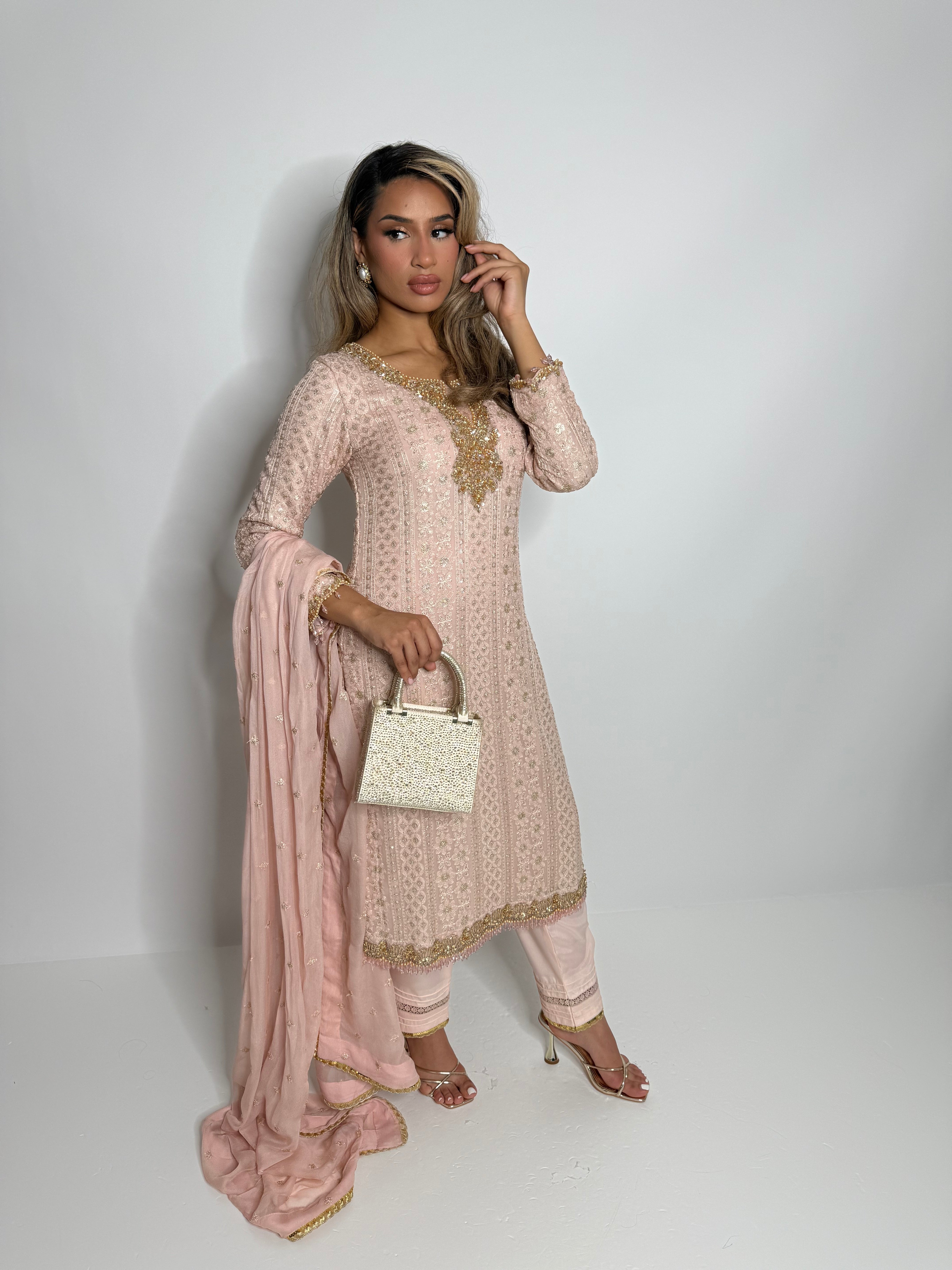 Model wearing blush pink chicken-kari chiffon three-piece with lace trousers and chiffon dupatta – front view.