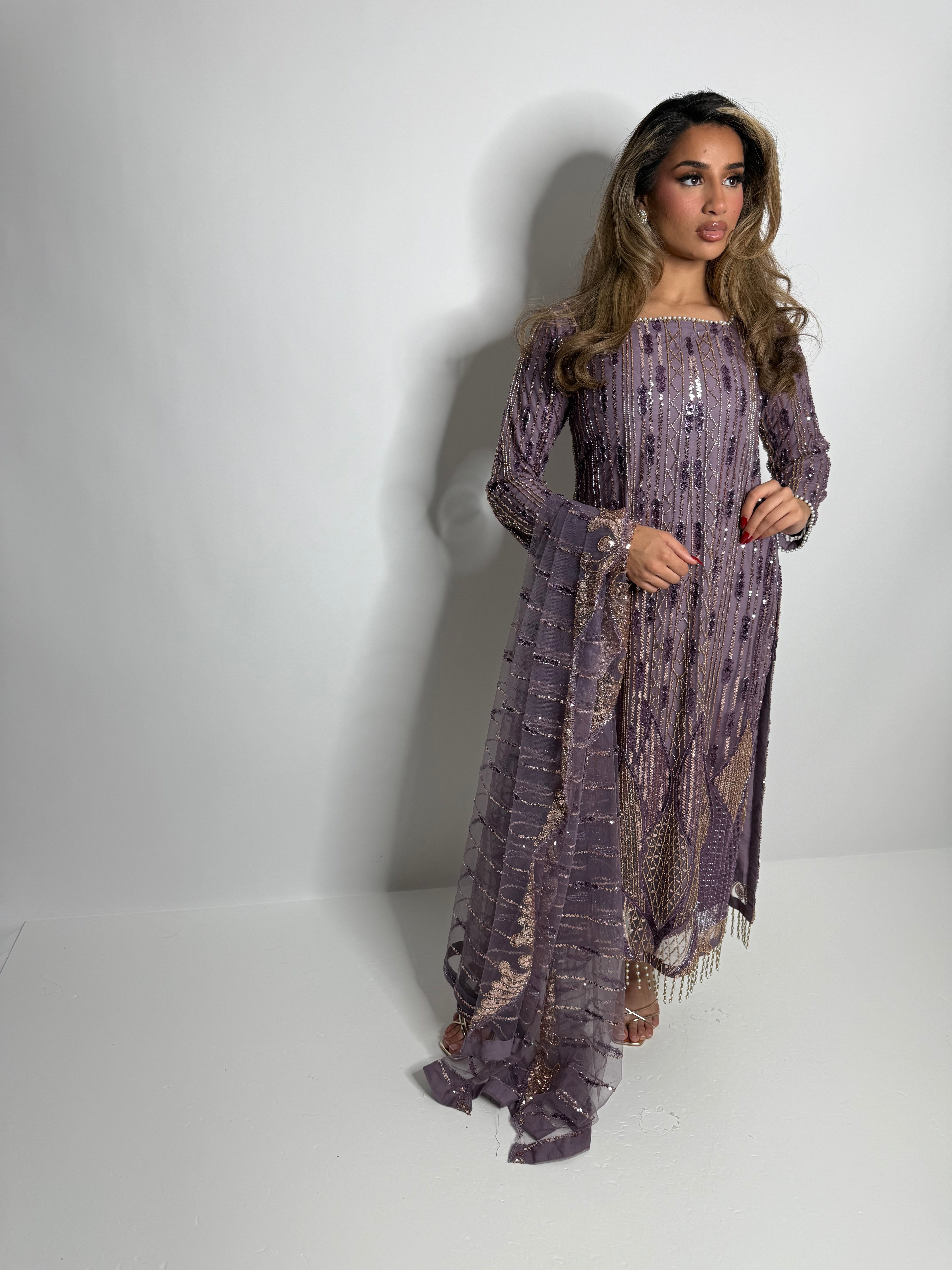 Elvara cutdana detail — beadwork shimmer in low light, luxe finish