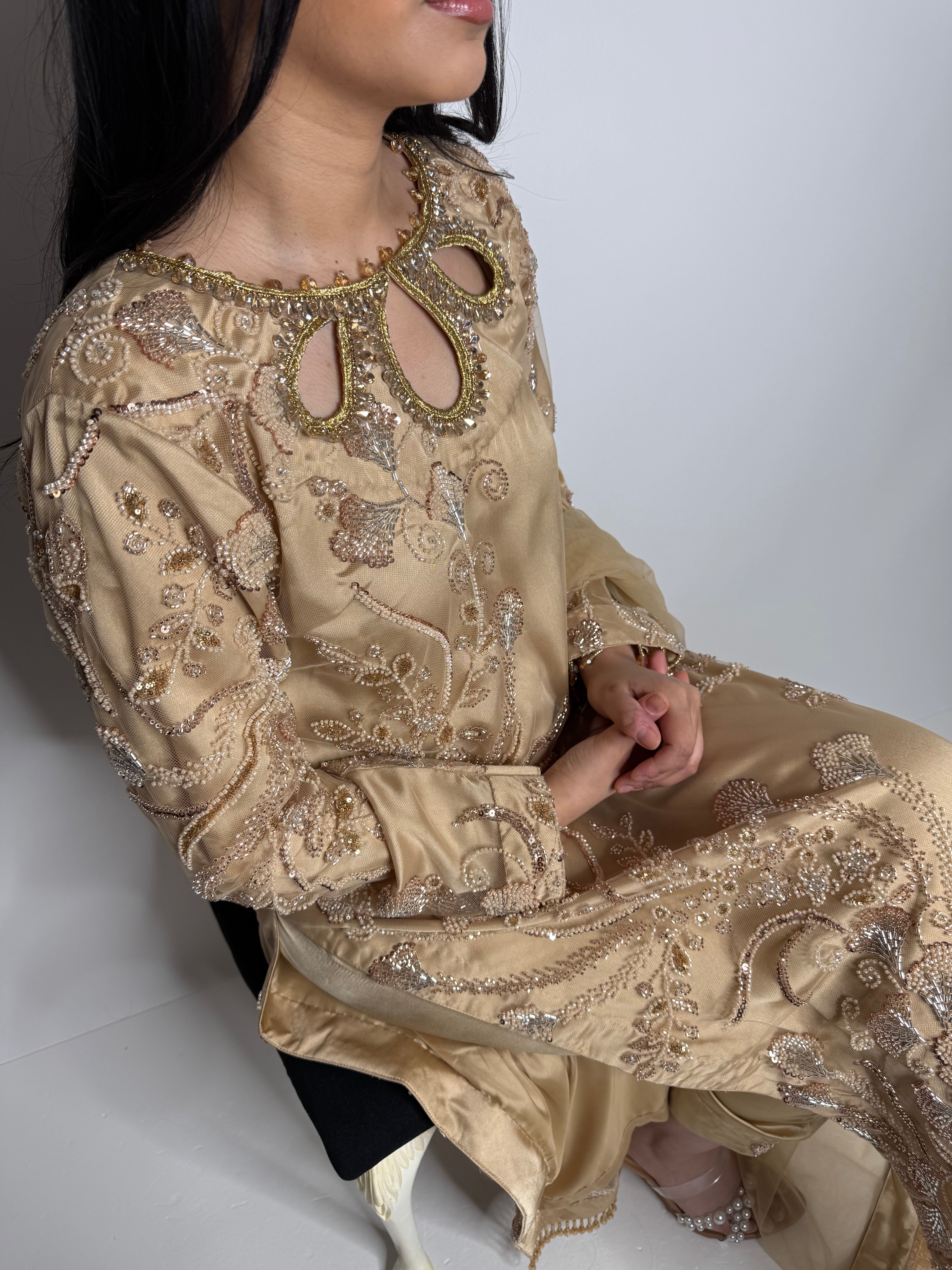 Luxury gold Pakistani formalwear outfit – embroidered front, back, and sleeves