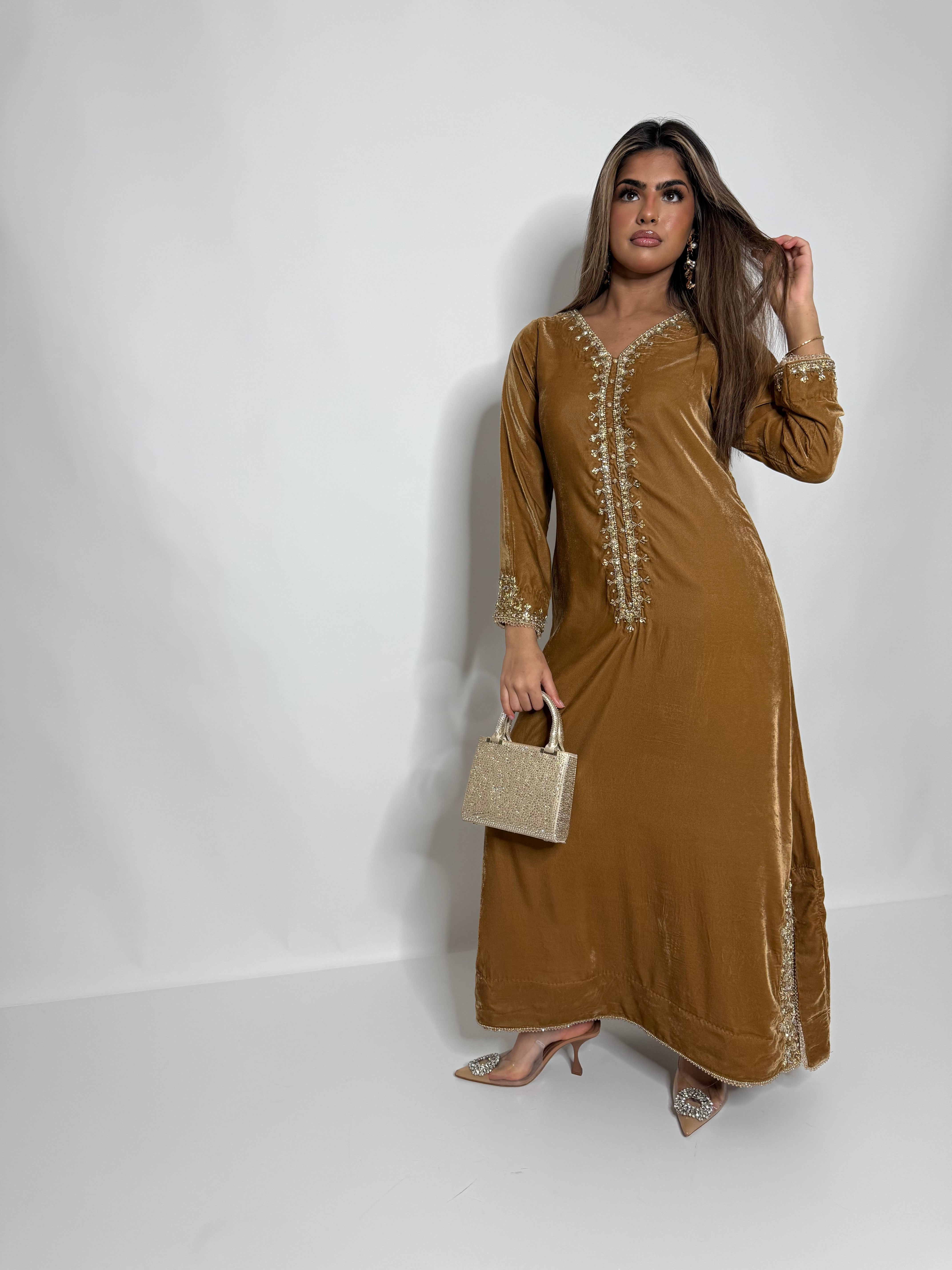 Elegant velvet kaftan dress for nikah and mehndi
Pakistani Eid dress 2026 mustard velvet collection