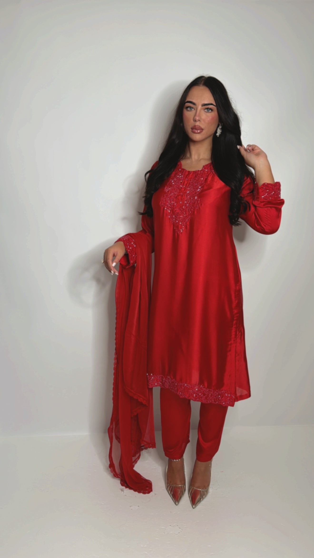 Pakistani wedding guest outfit in bold red satin with embroidery