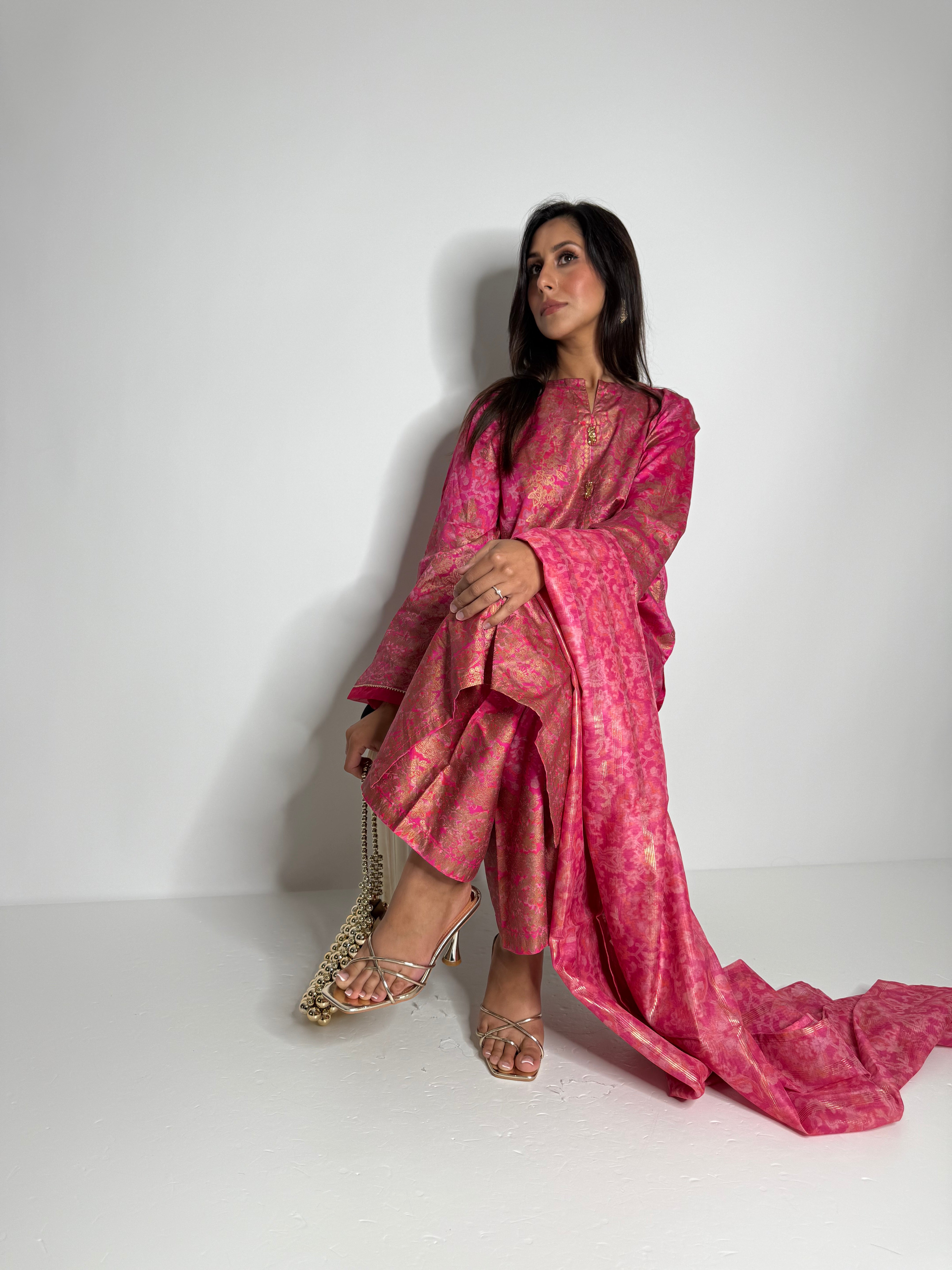 Designer Limelight three-piece silk suit in vibrant pink, including kameez, wide-leg trousers, and dupatta.