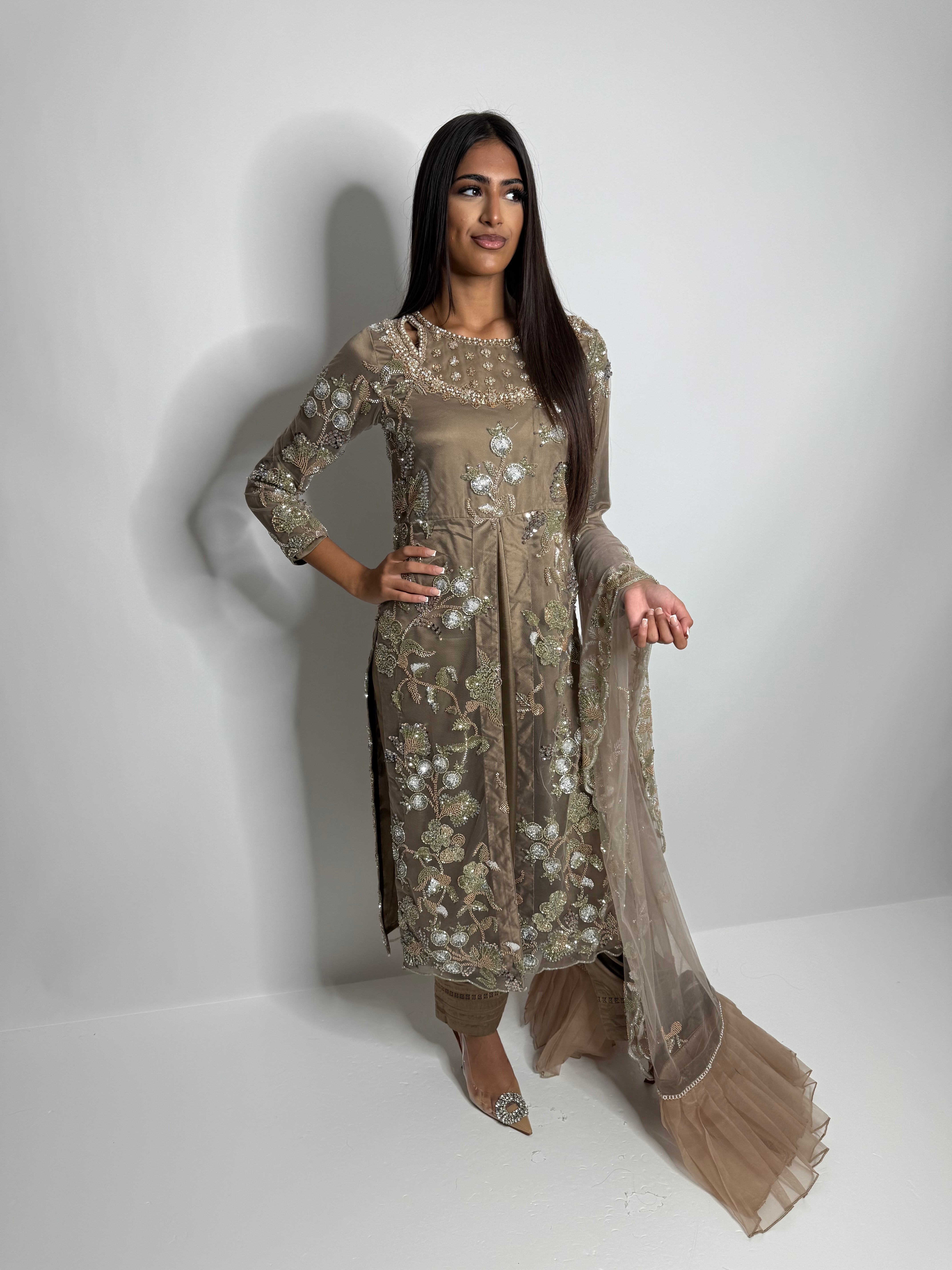 Full Noorah outfit featuring embroidered kameez with handwork, tailored trousers, and embellished net dupatta.