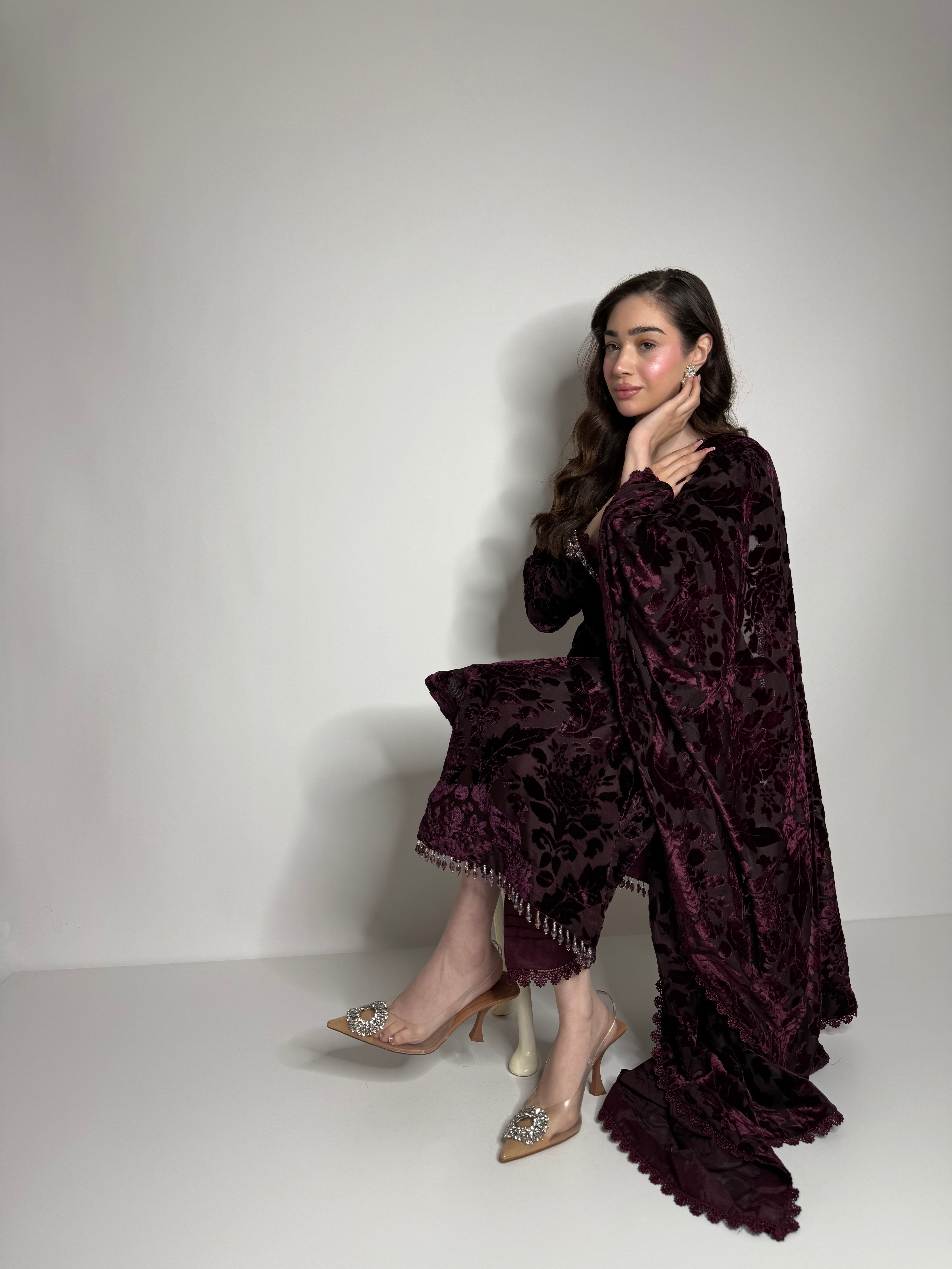Pakistani winter occasionwear in plum palachi fabric