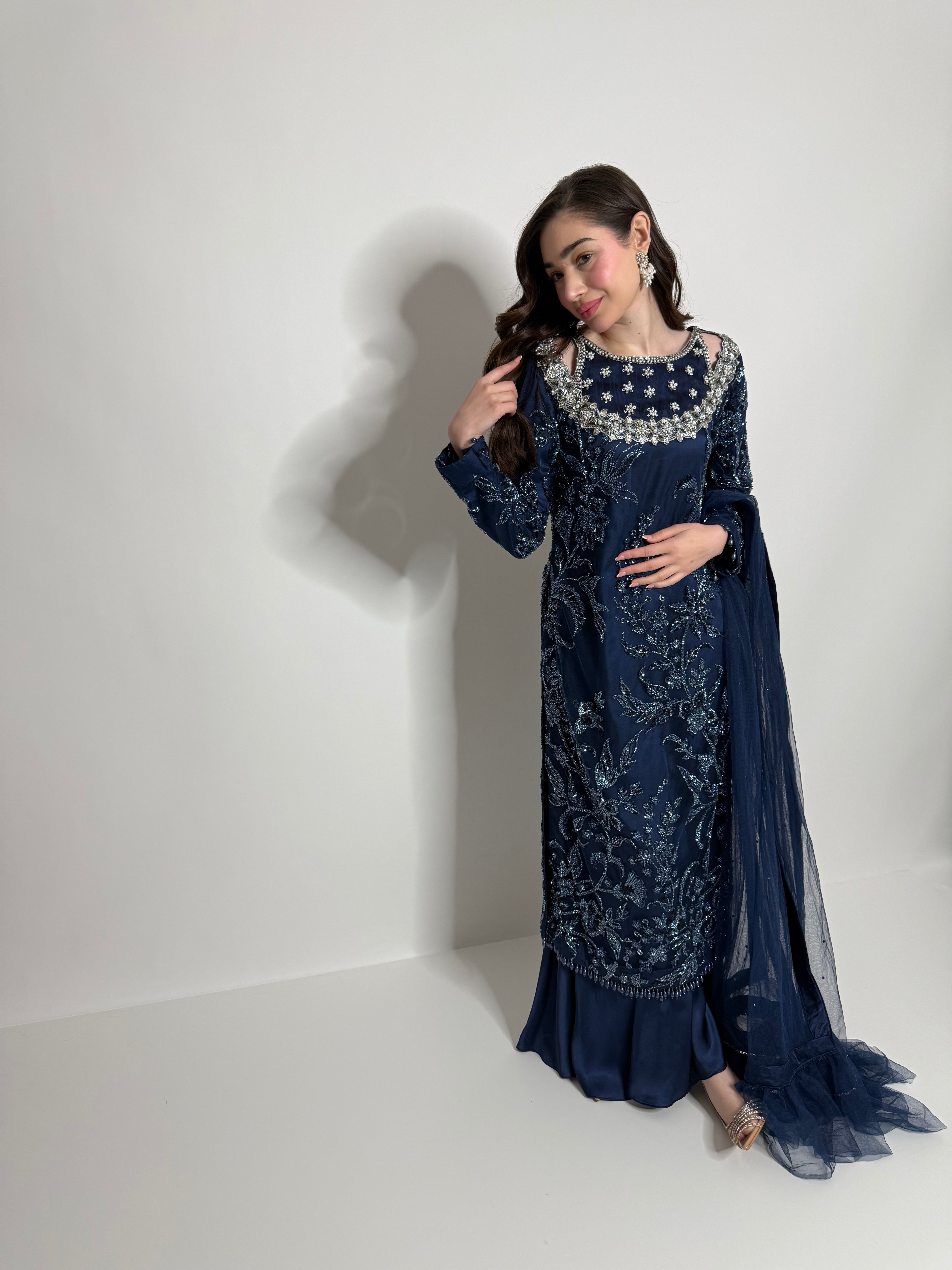 Elegant navy Pakistani outfit styled for Eid celebrations and wedding events