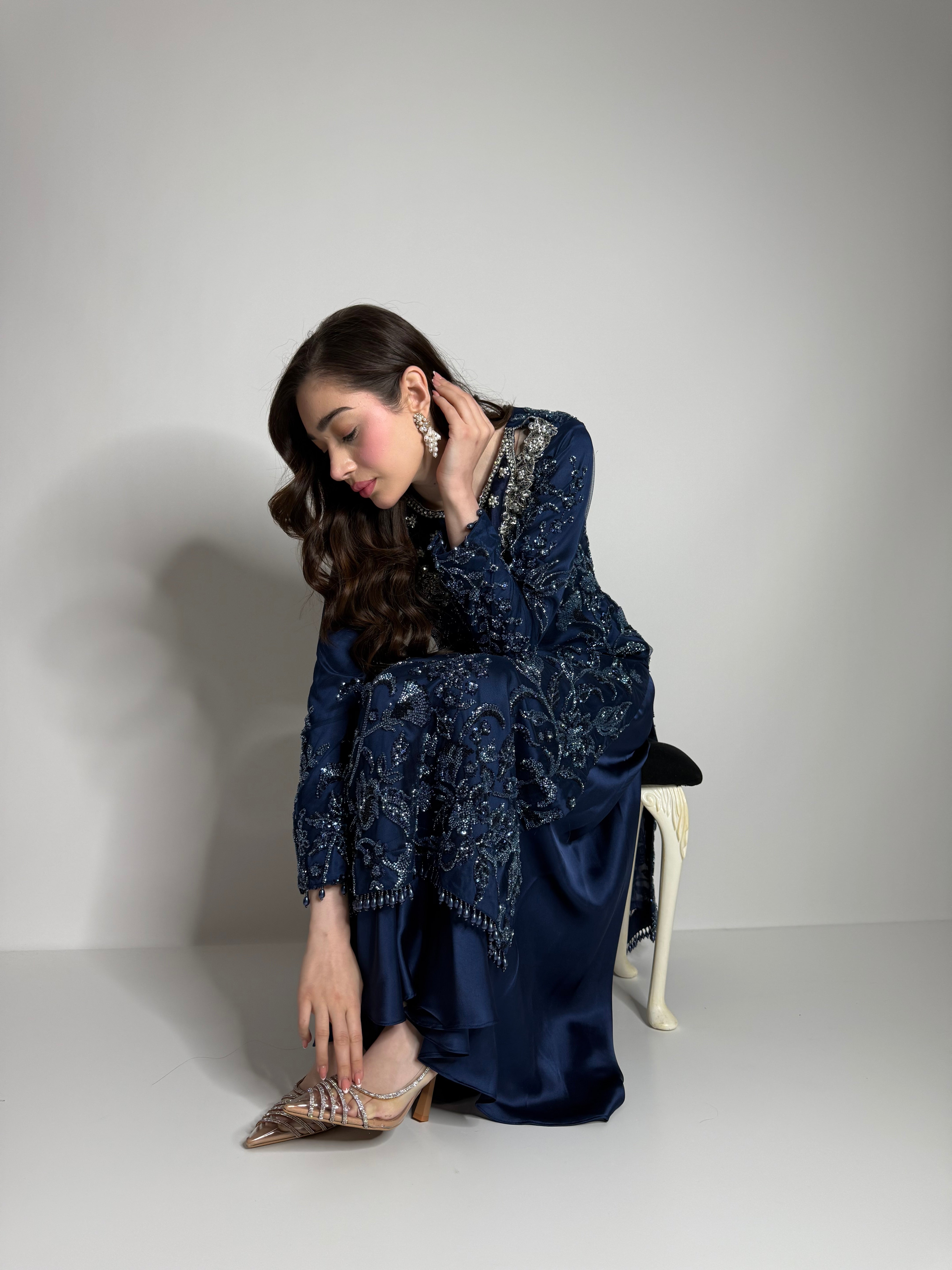 Full three-piece navy silk outfit styled as luxury Pakistani wedding guest wear
