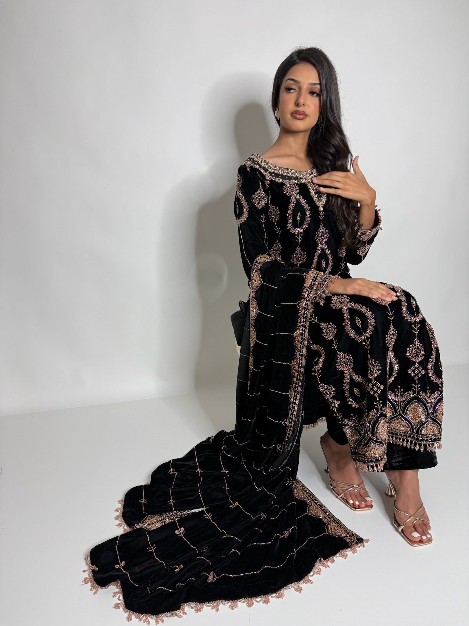 Flared velvet trousers paired with embroidered black velvet kam