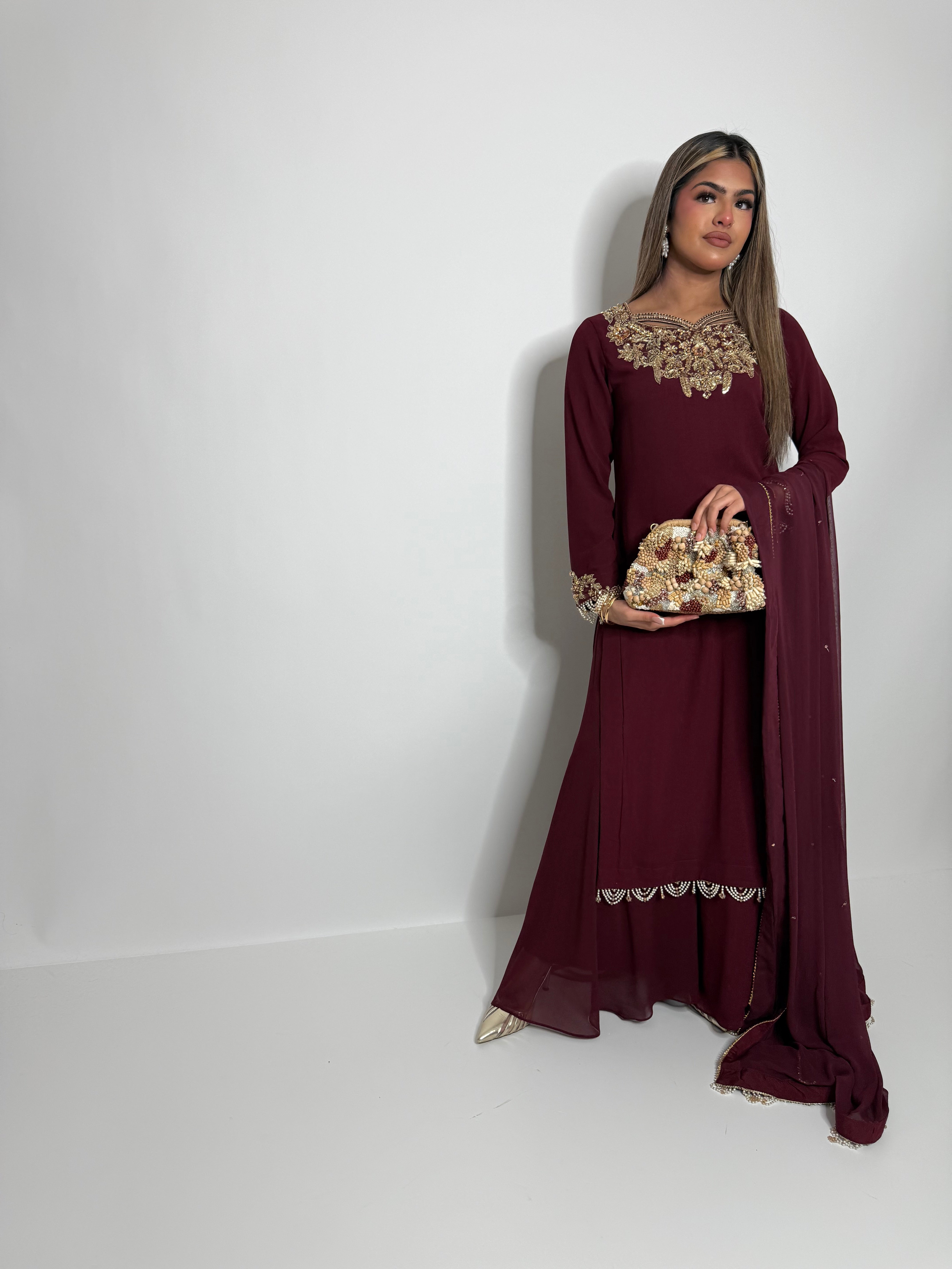 Maroon embroidered outfit with statement neckline