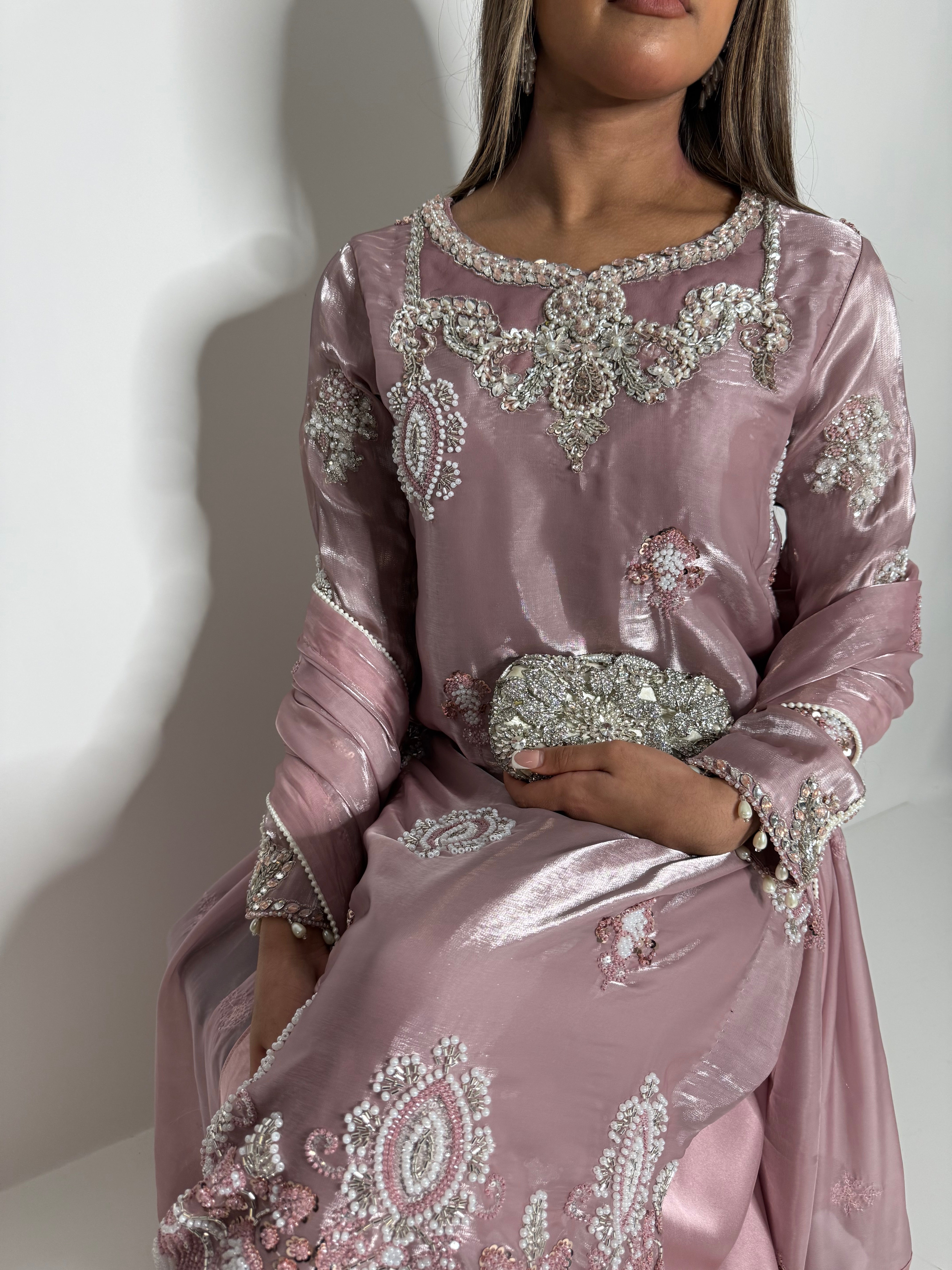 Wedding guest outfit with blush pink silk and detailed embroidery