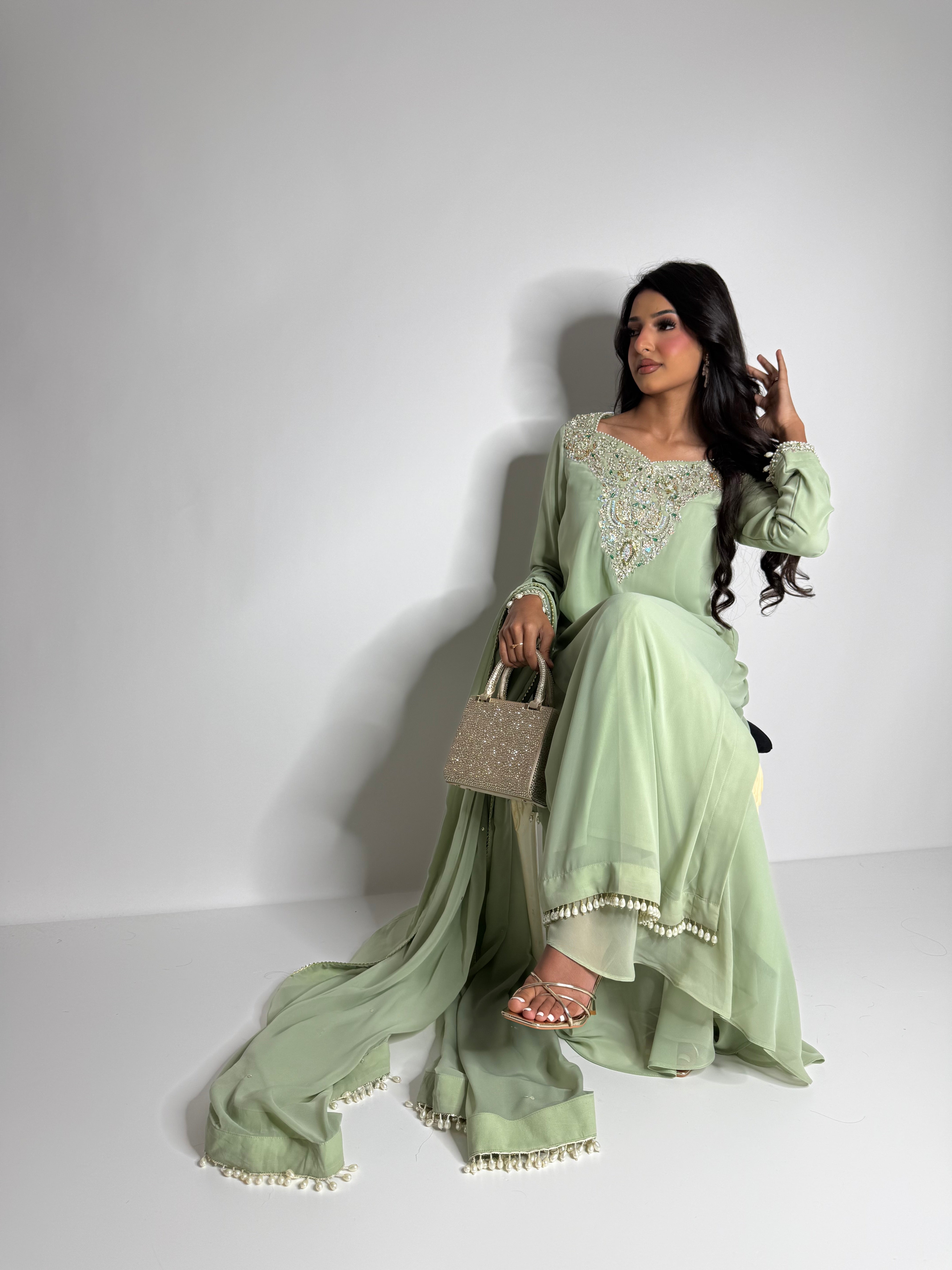 Dholki outfit with sage sharara and pearl finishing