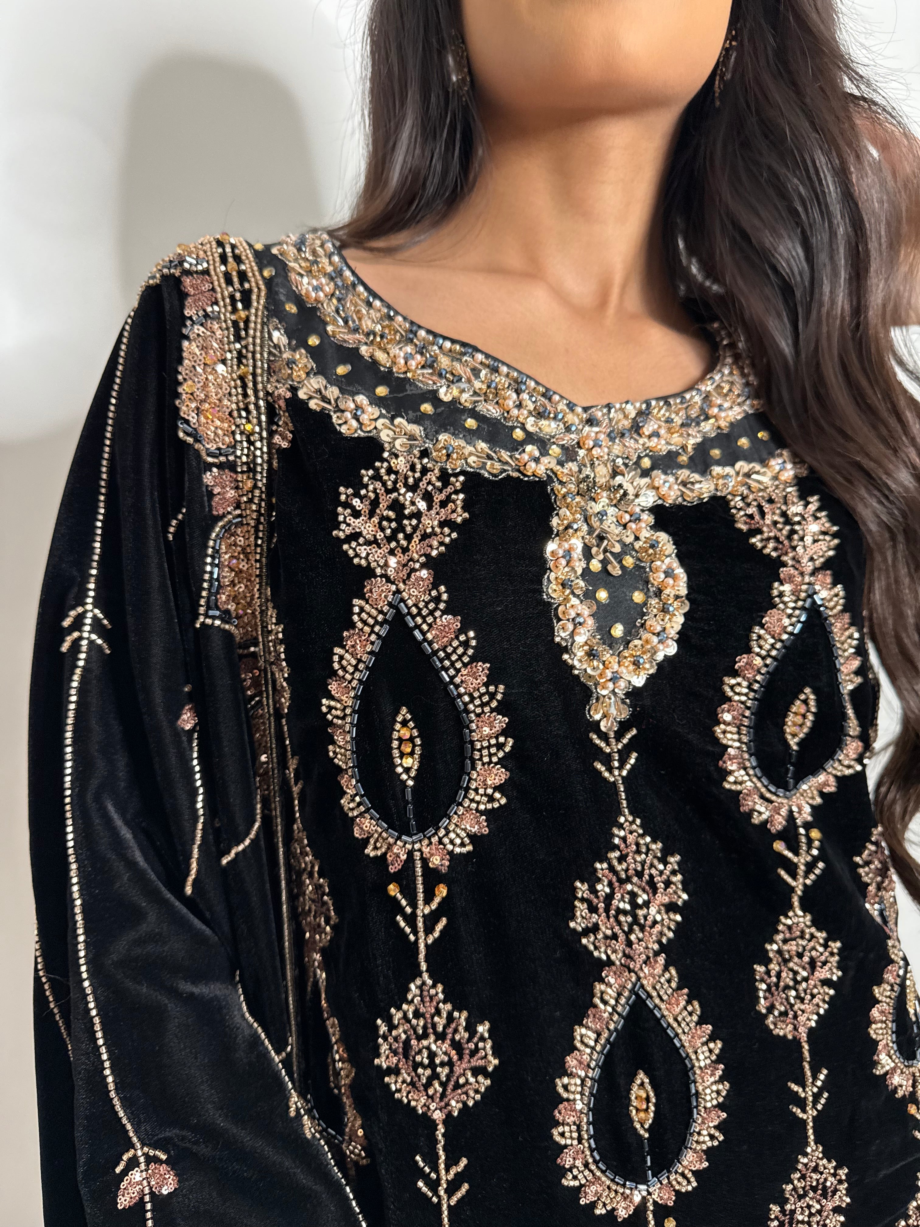 Detailed neckline embroidery on black velvet Pakistani suit