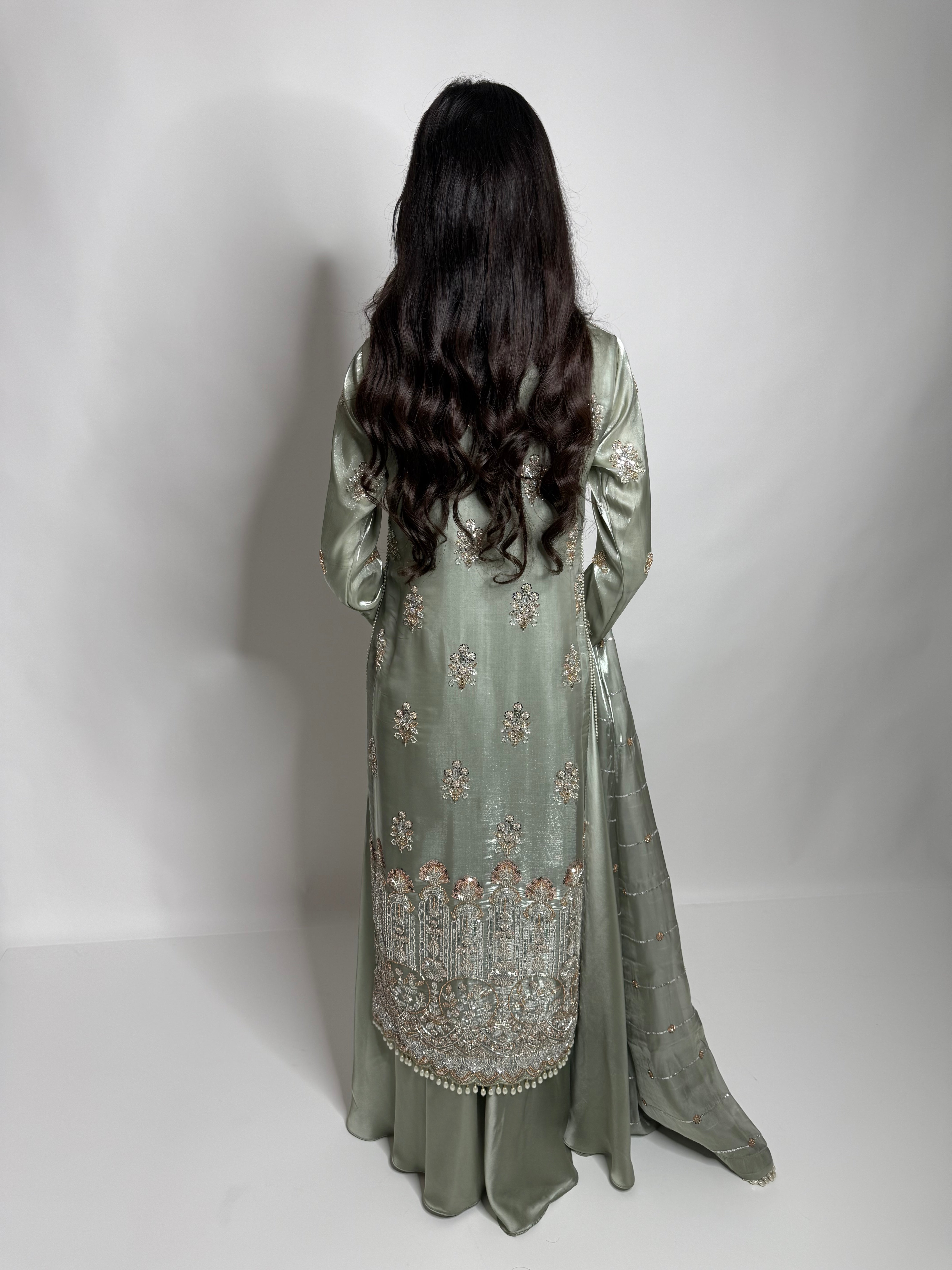 Elegant sage green nikah outfit with flowing silk sharara