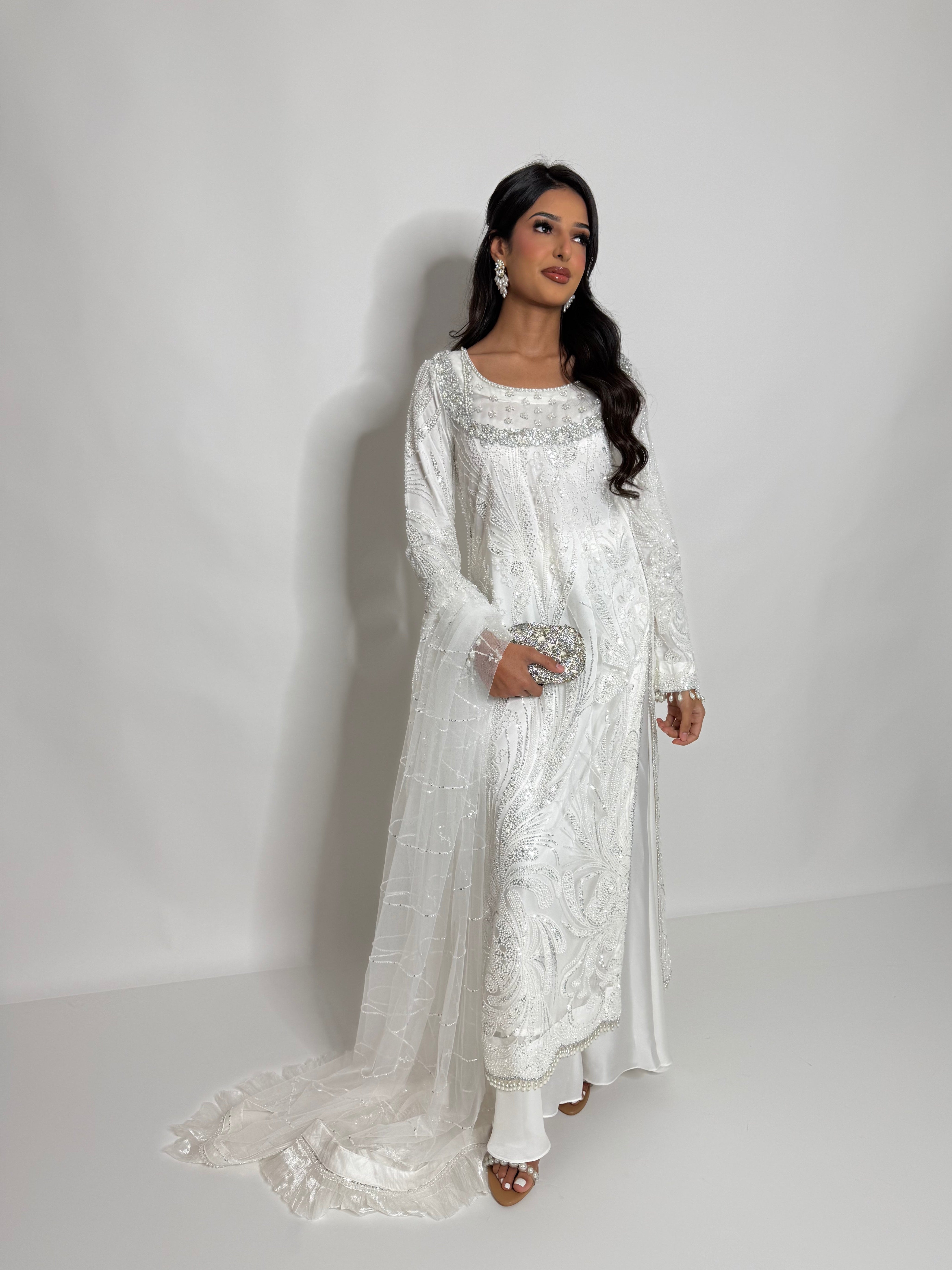 Detailed hem embroidery with pearl finishing on white sharara suit