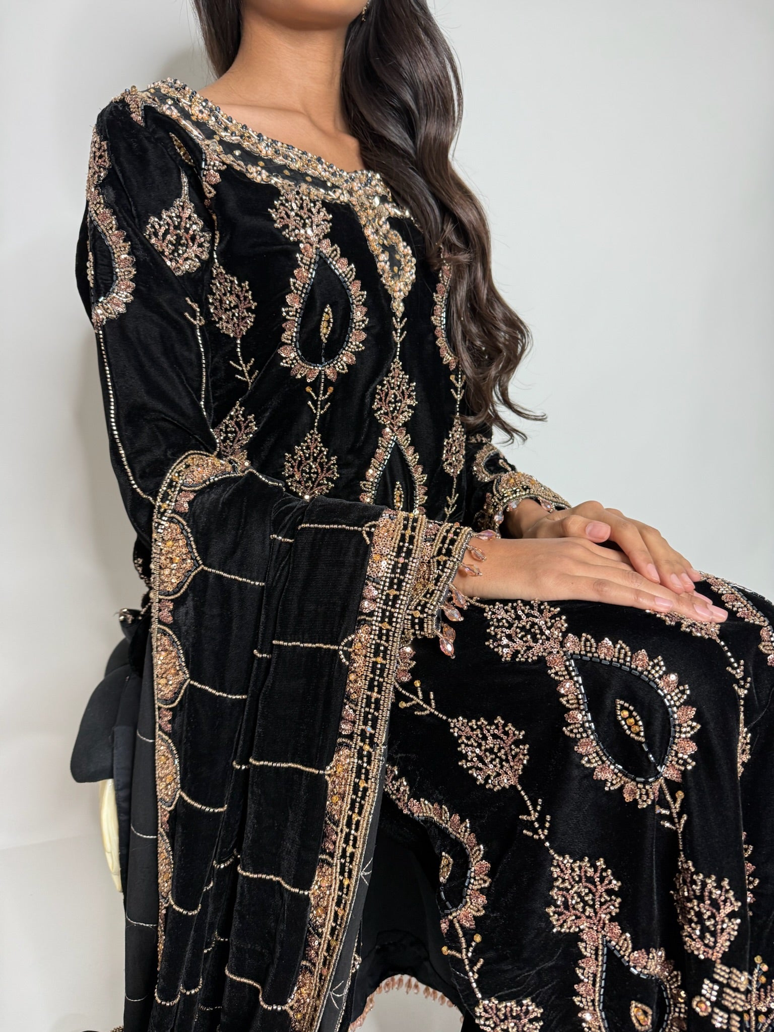Detailed neckline embroidery on black velvet Pakistani suit
